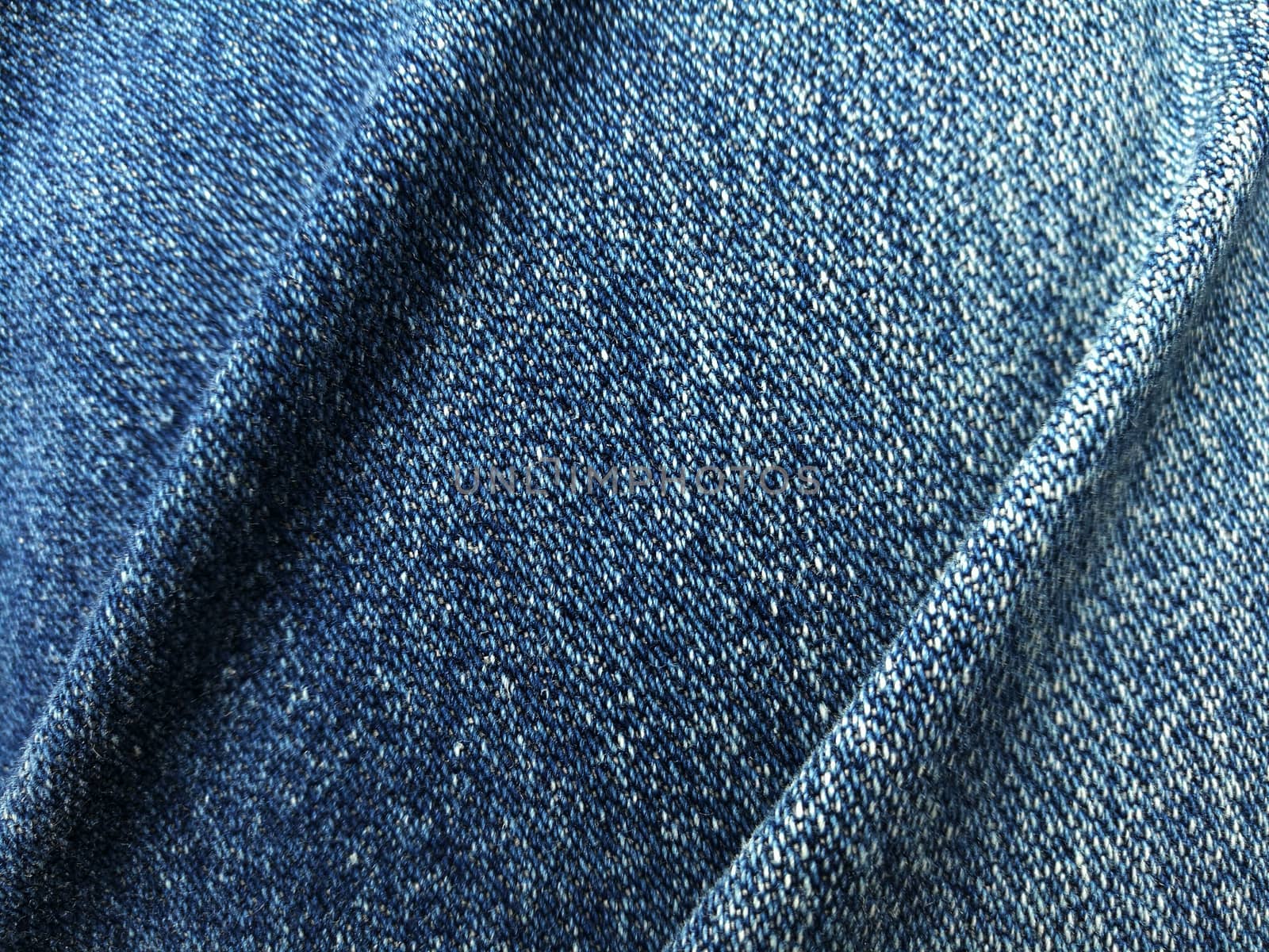 Close up blue jeans denim fold by duntaro