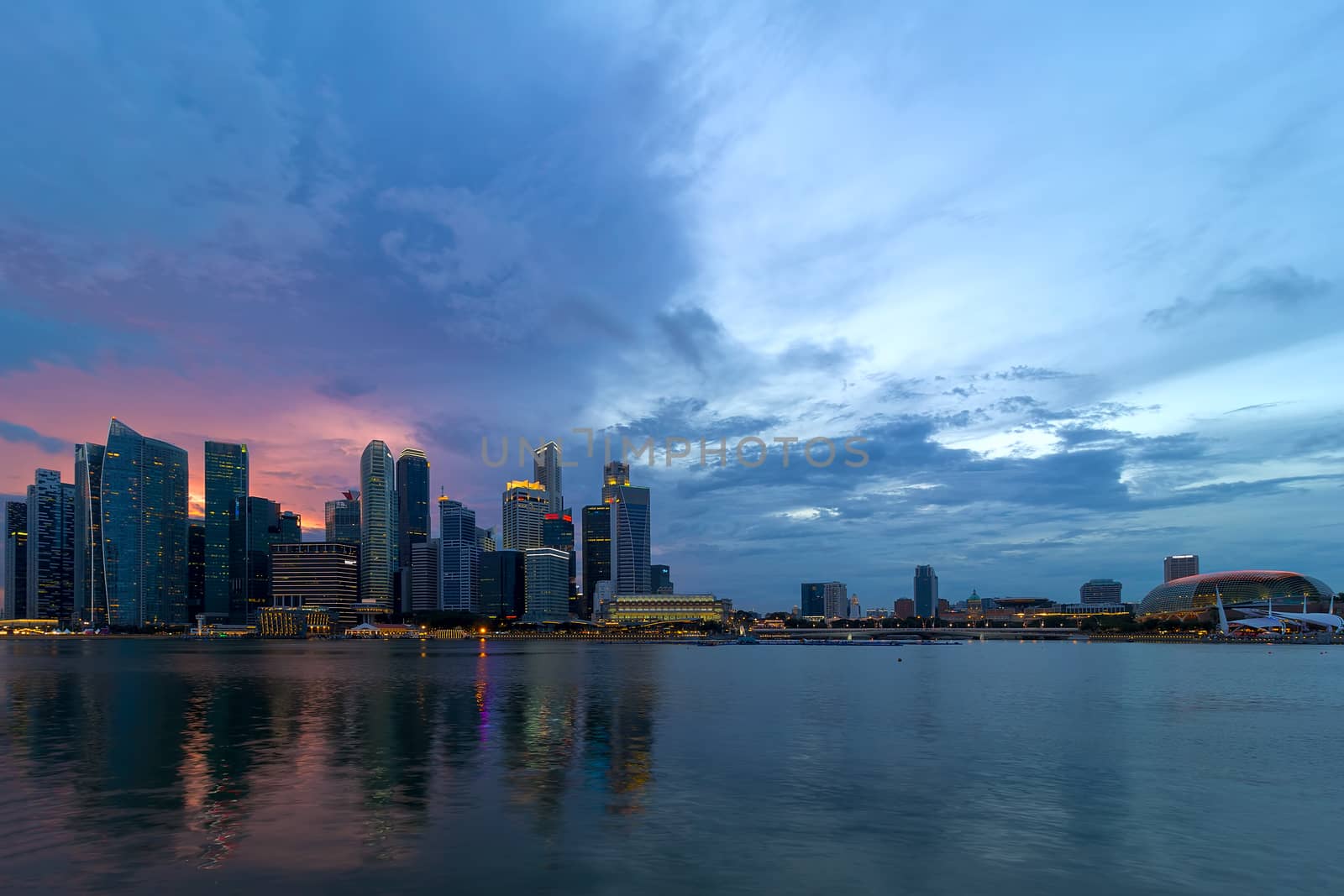Sunset over Singapore Central Business District City Skyline by Marina Bay