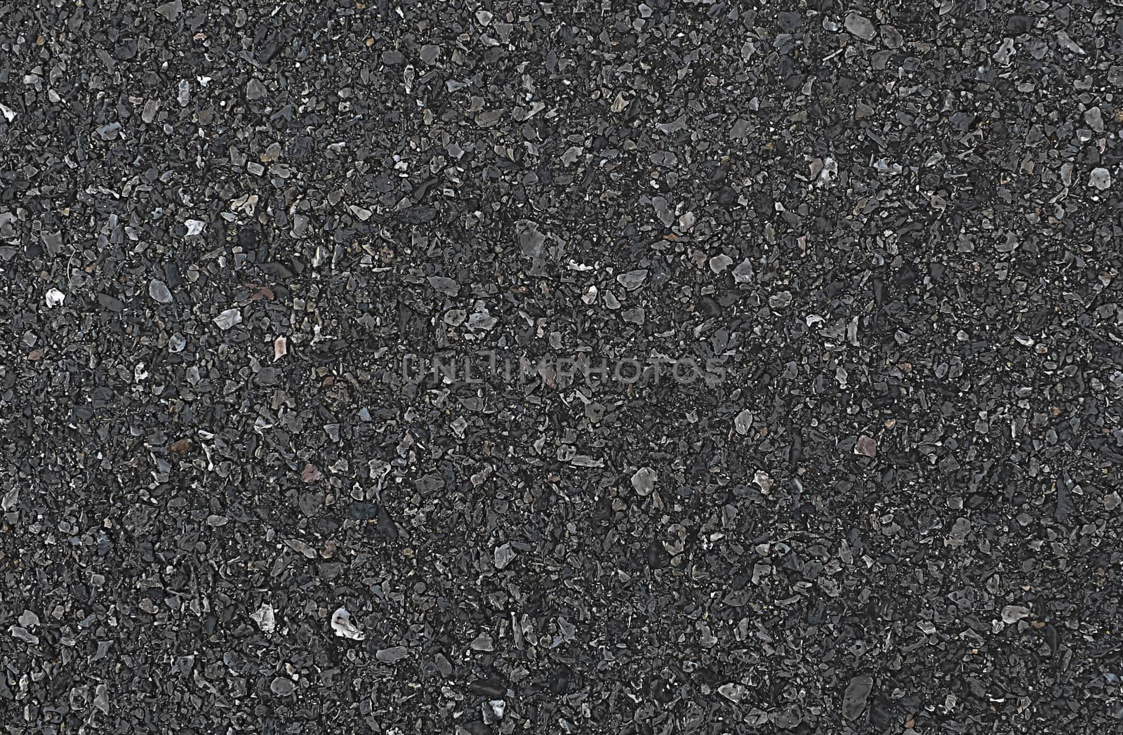 The gray background of black asphalt road.