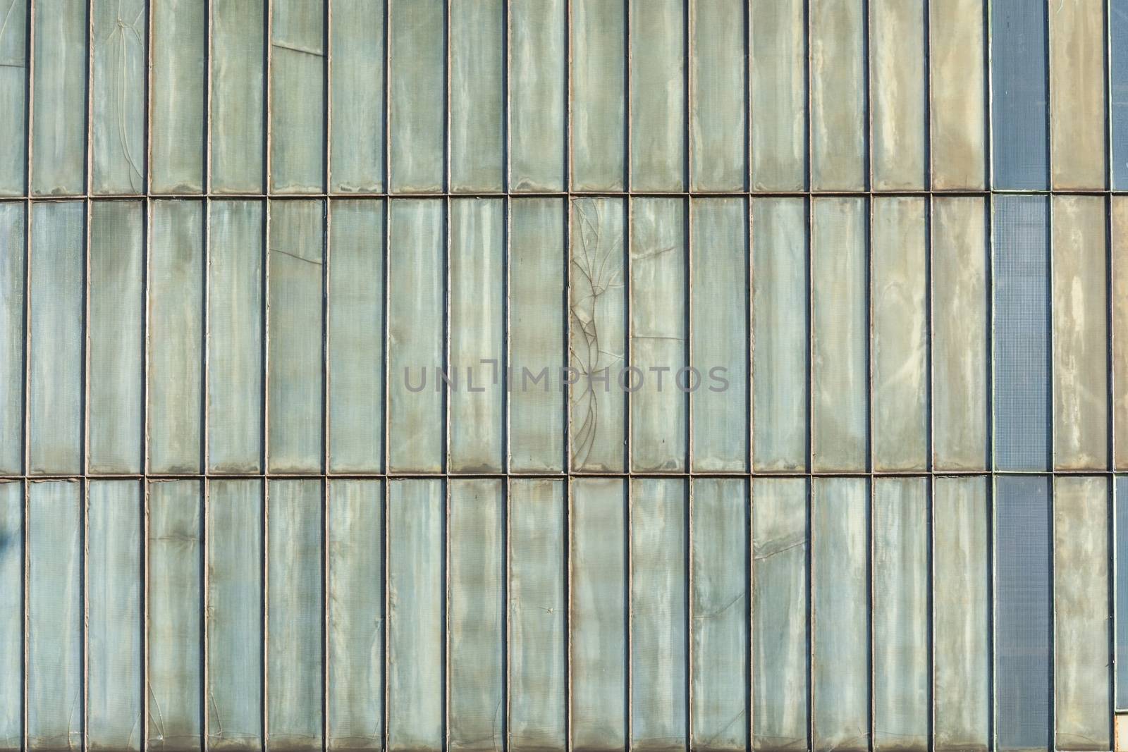 Silver-colored metal wall corrugated sheet metal background.