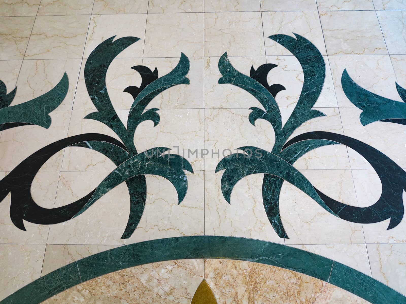 A pattern, design, on a tile floor