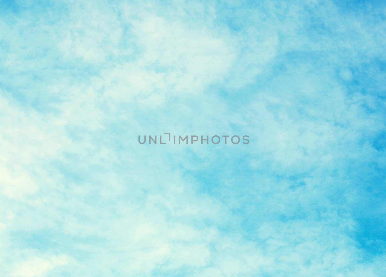 Blue sky with clouds background.
