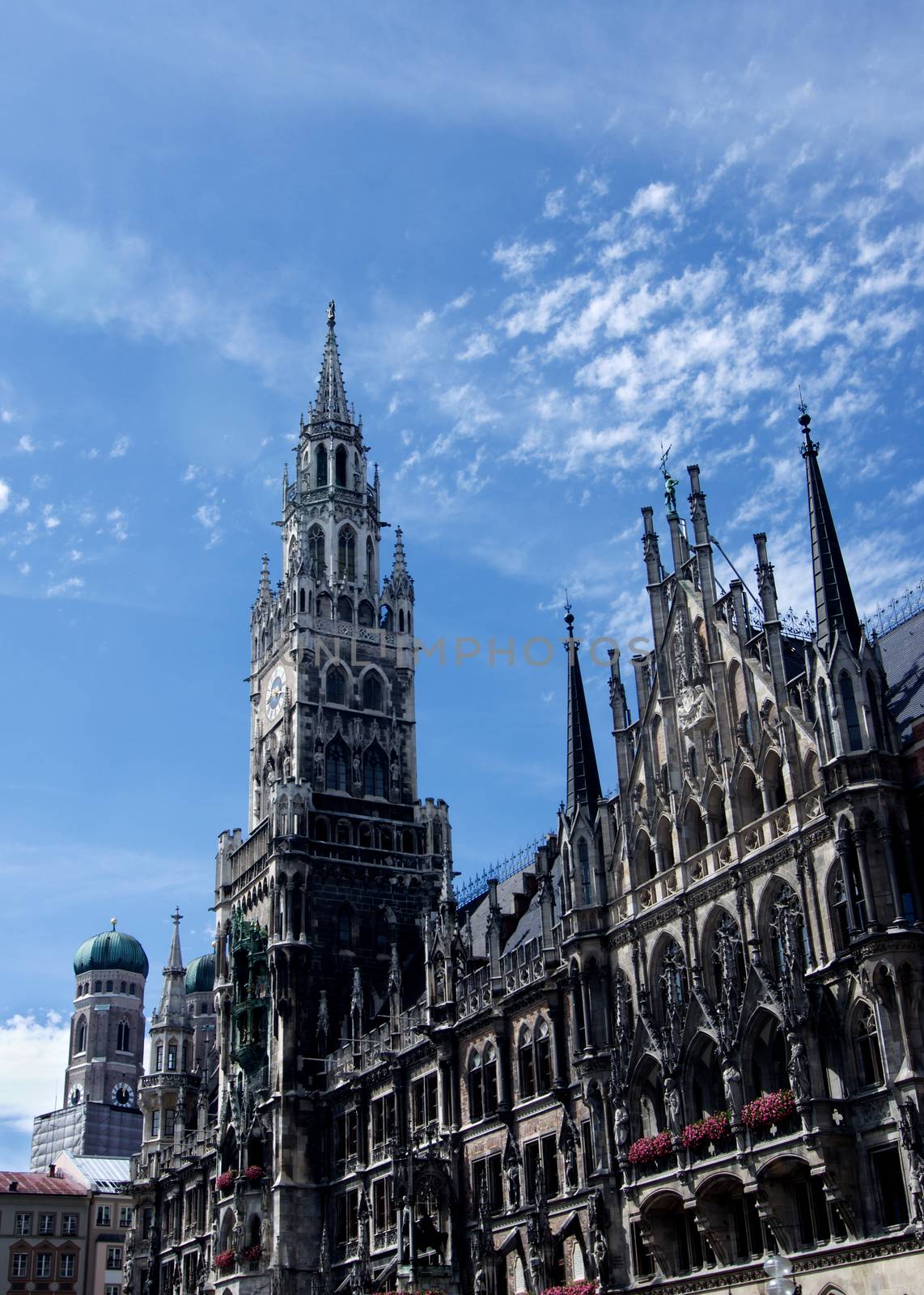 Clock Tower MarienPlatz and Tower of Frauenkirche against Blue Sky Outdoors. Munich, Germany