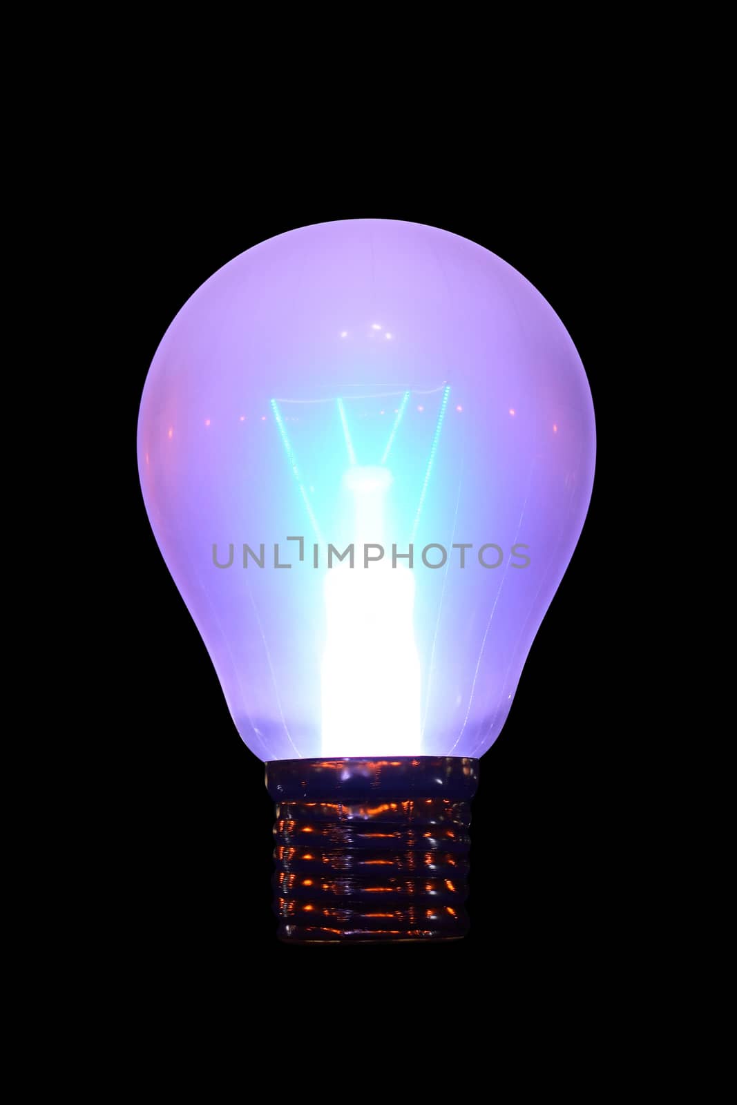 Glowing electric bulb on dark background