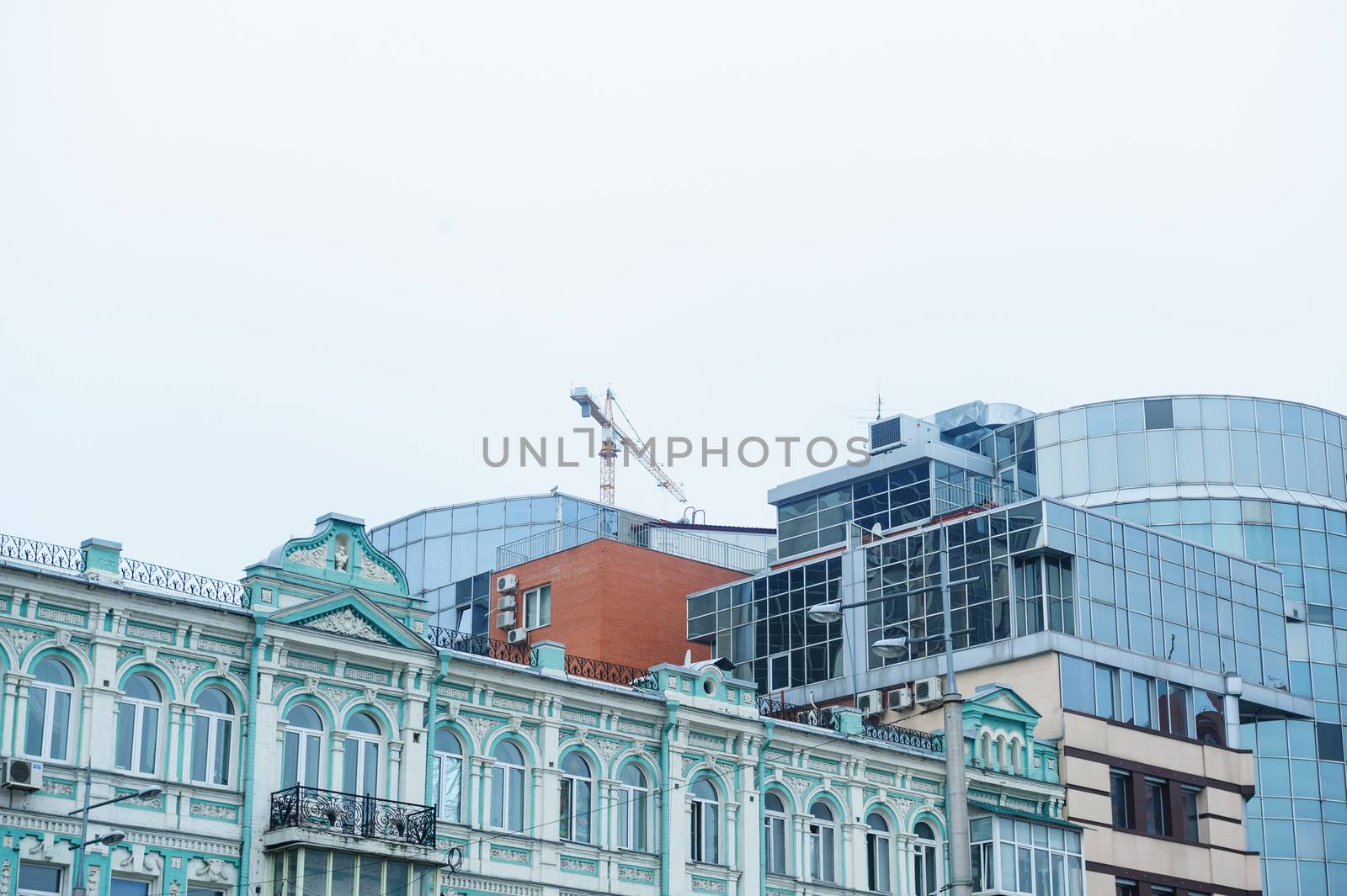 construction of multi-storey office building on the sky background by timonko