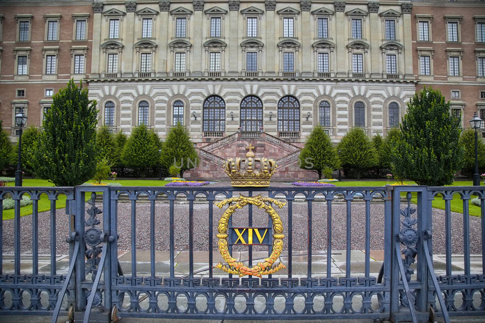 The fence of the Royal Palace with crown in Stockholm, Sweden