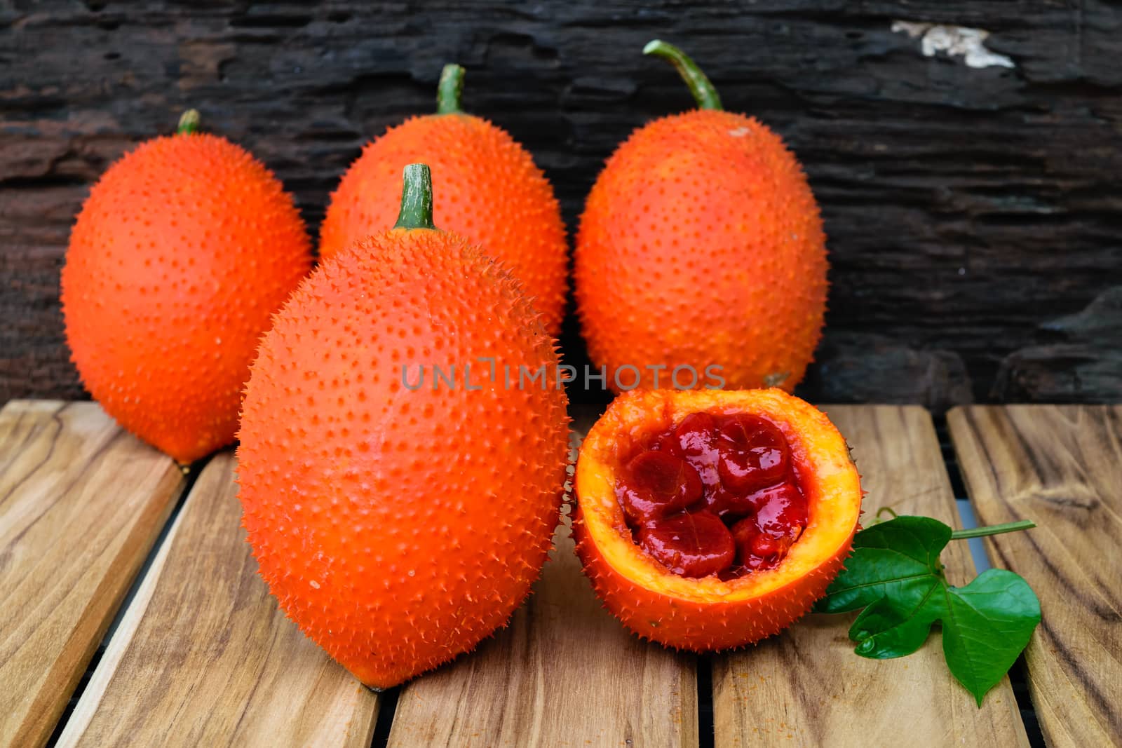 baby jackfruit spiny bitter gourd on wooden background