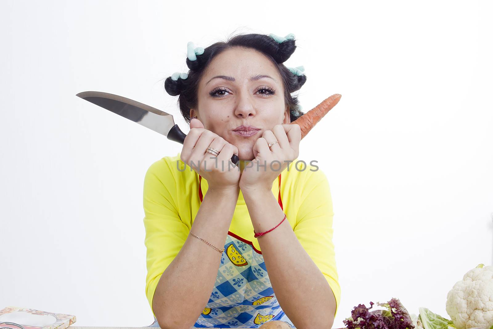 Housewife is preparing in the kitchen on a white background