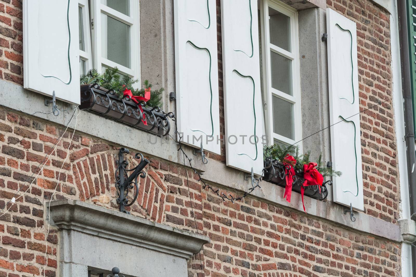 Christmas decoration of an exterior wall of a house with brickwork.