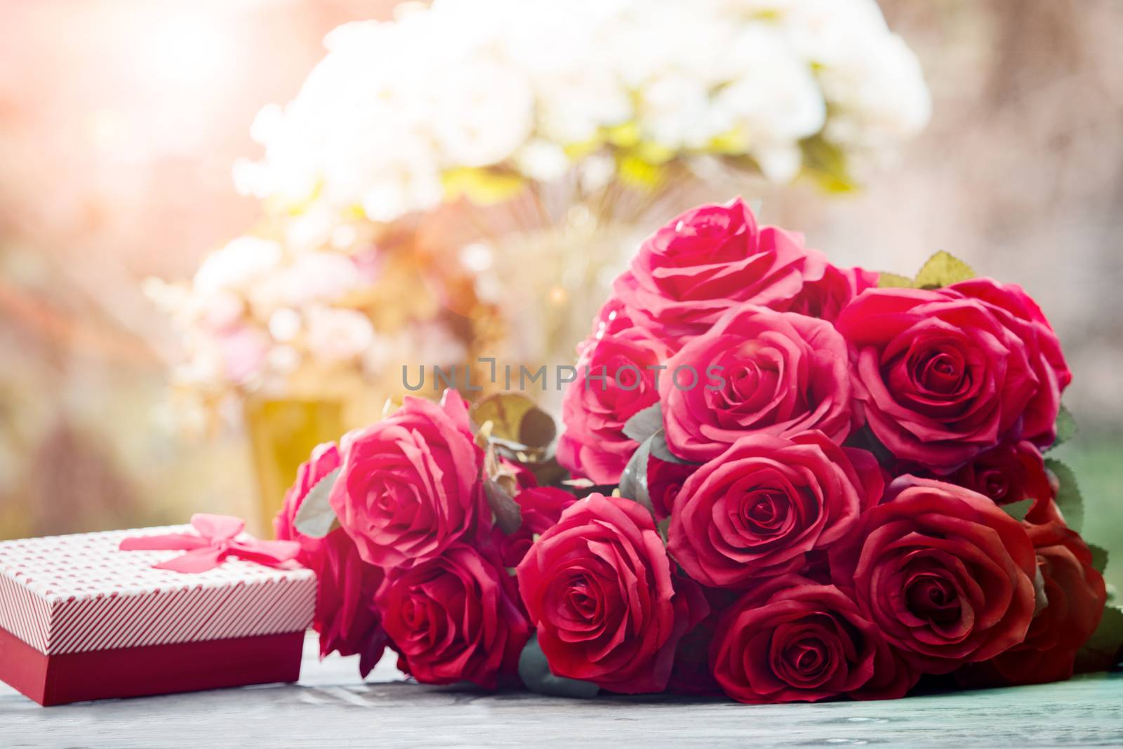 red roses flowers with valentine festival gift and beautiful blur bouquet background 