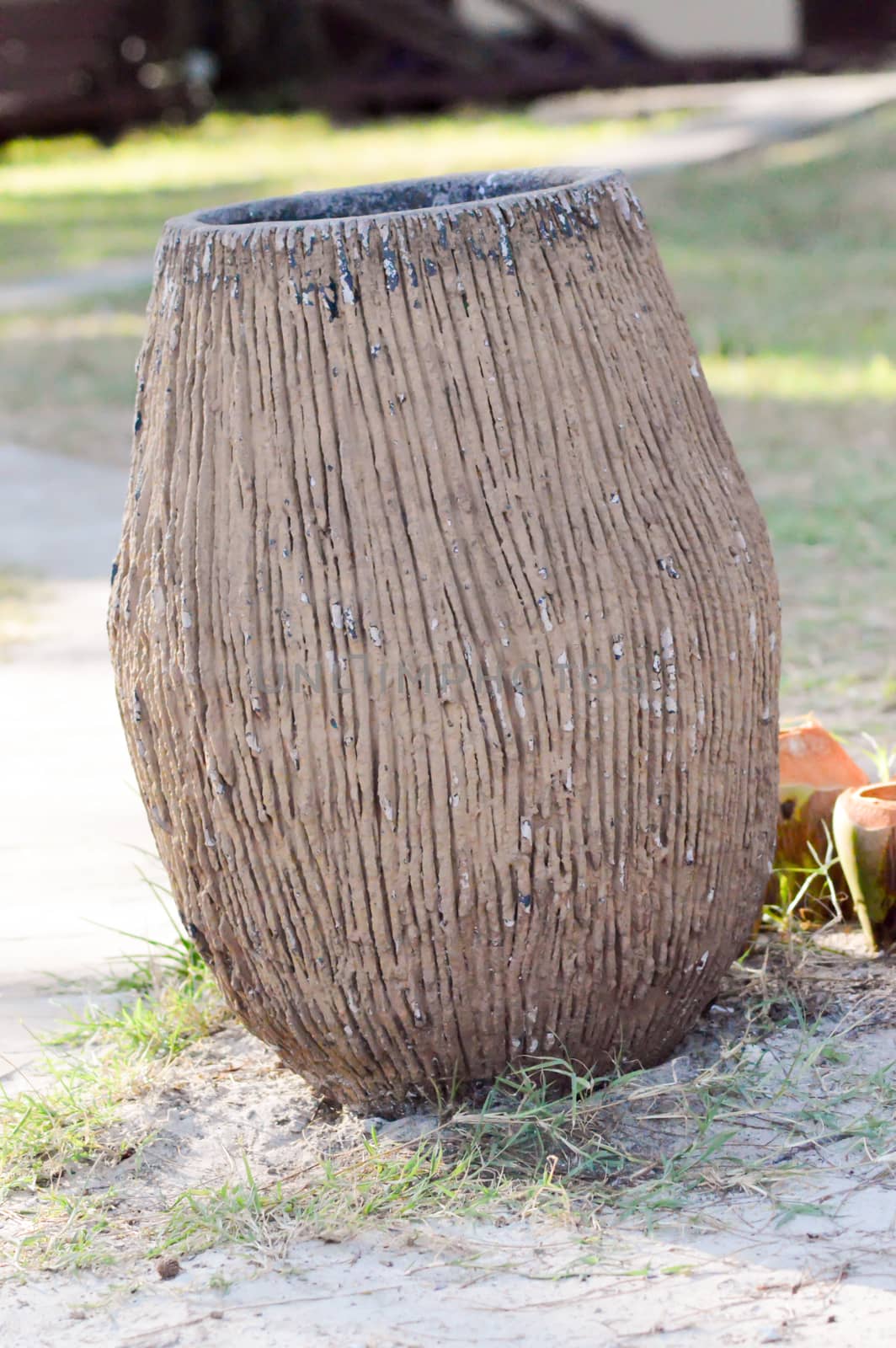 Waste trash bin laid on a lawn in Kenya