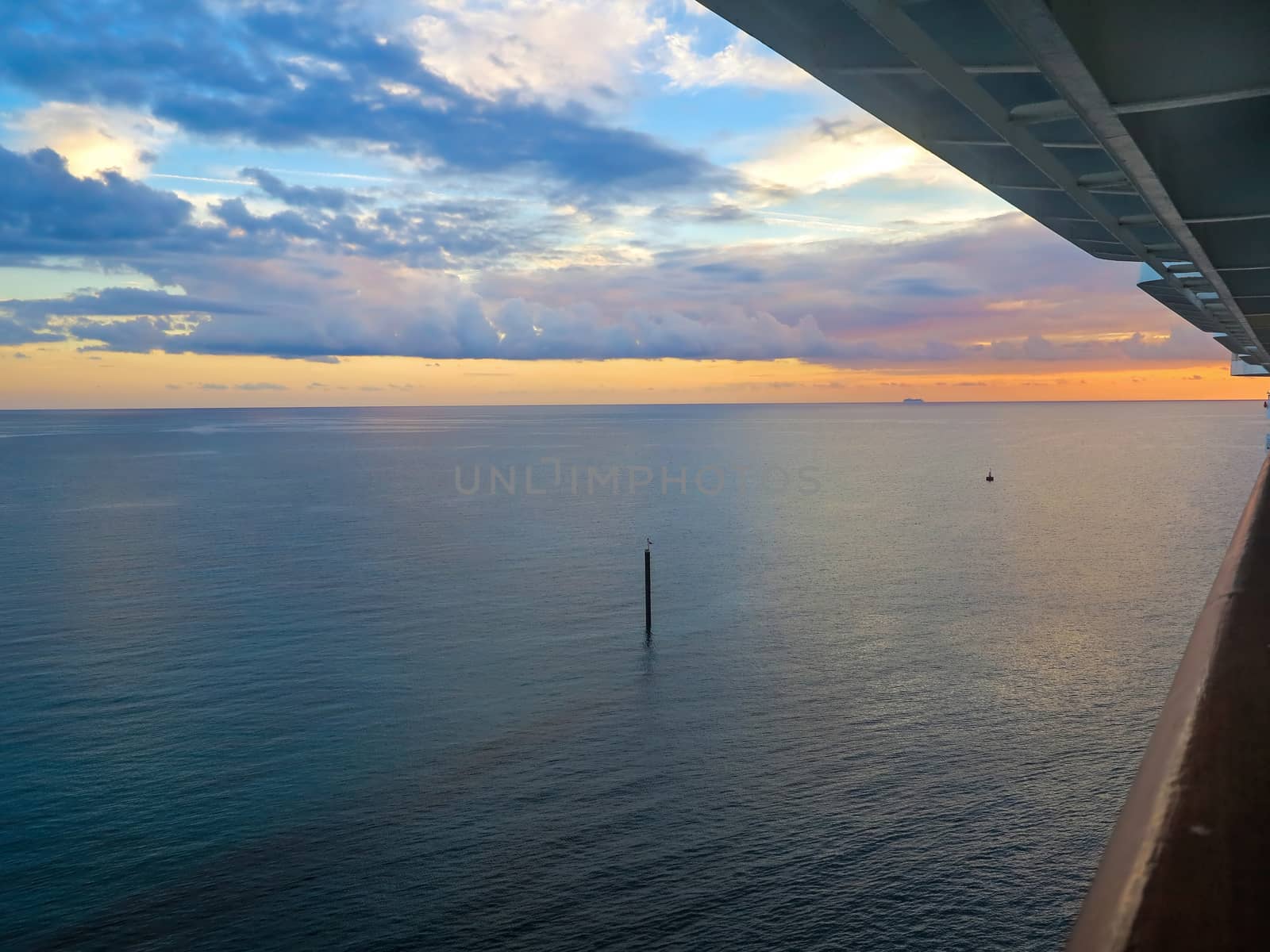 A sunset over the ocean from a cruise ship