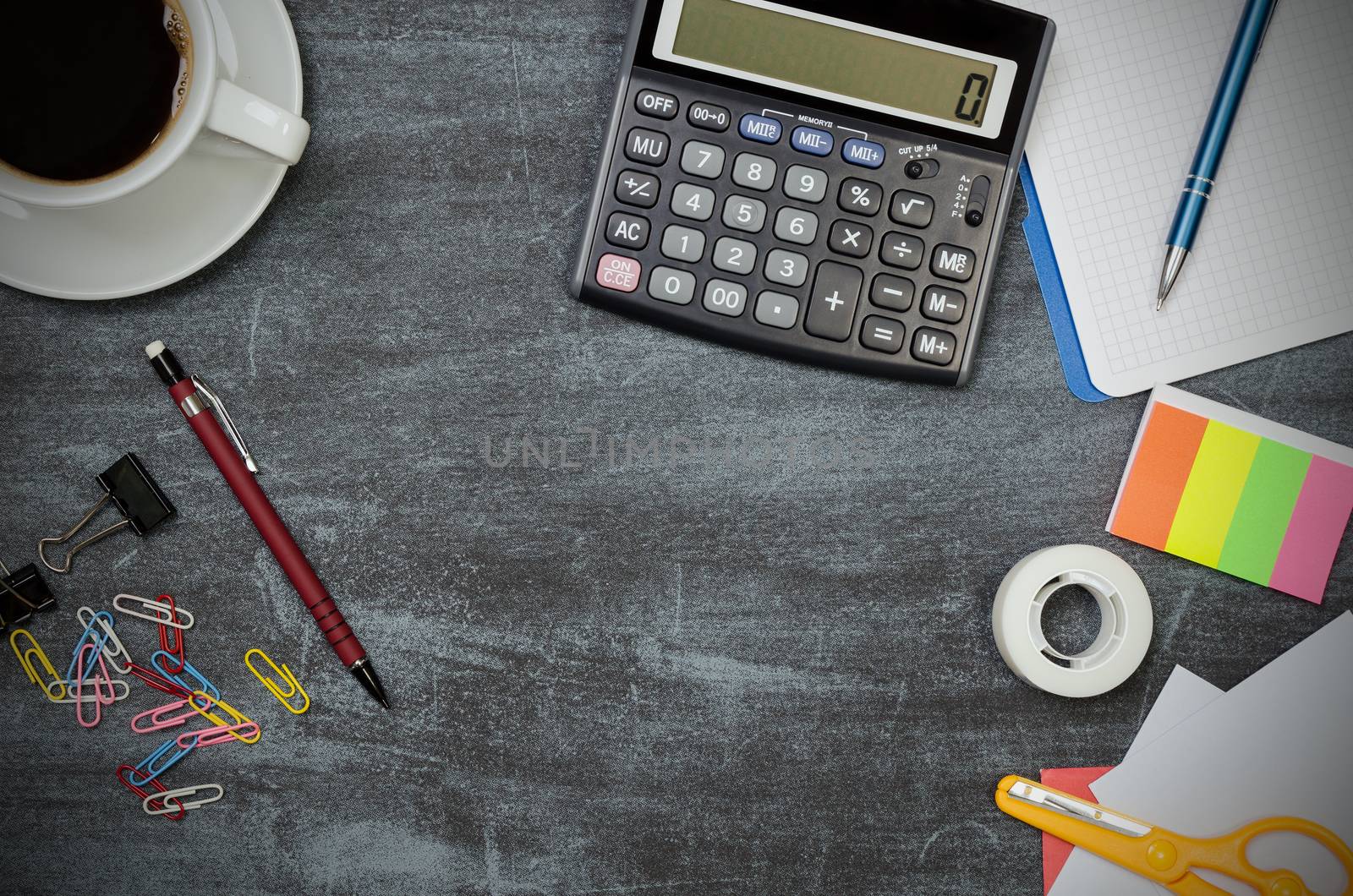 Business desk in office top view. Table with calculator, cup of coffee, notepad, and office supplies. Copy space website banner concept