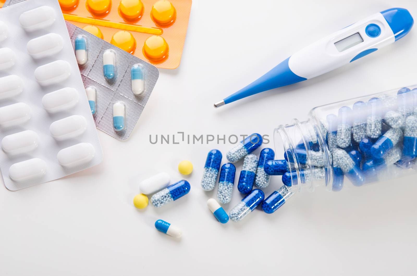 Different types of drugs on white background. pills medicine blister pill white thermometer medication health concept
