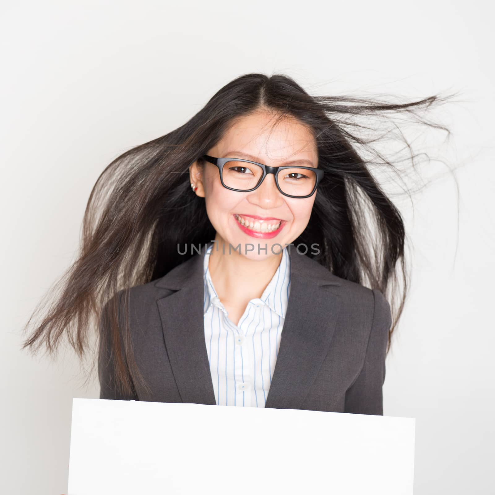 Businesswoman with white blank paper card by szefei