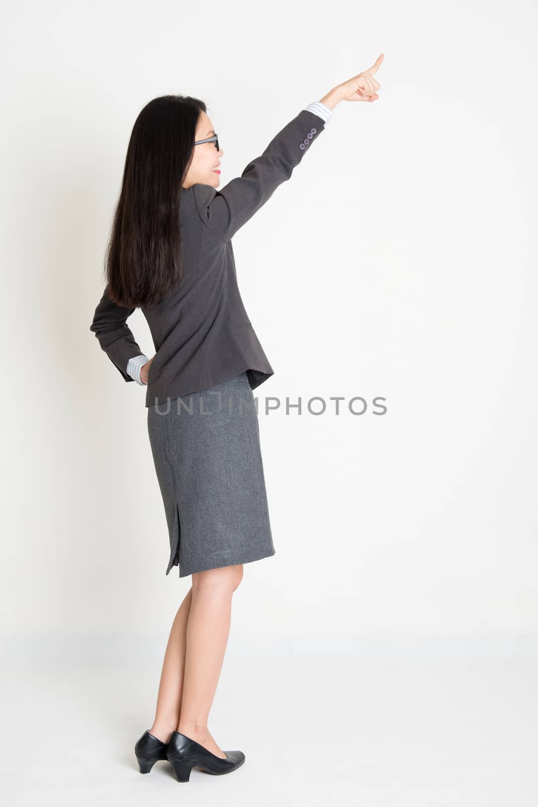 Asian businesswoman pointing away by szefei