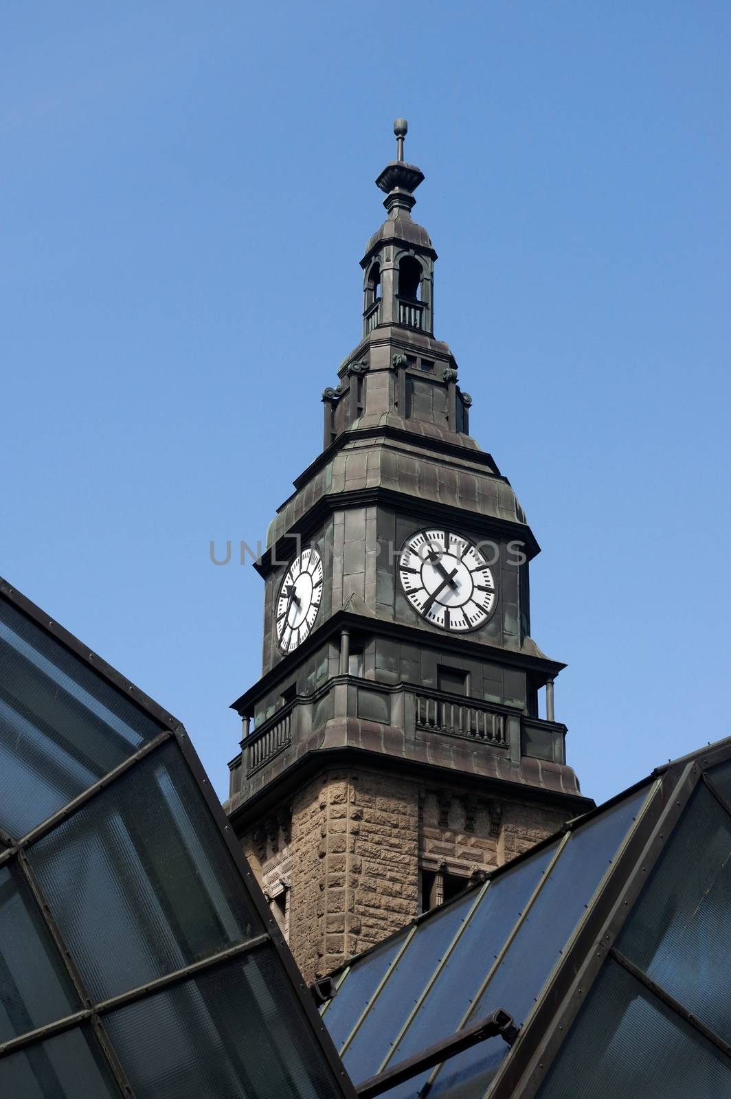 clock tower of Hamburg mail railway station in Germany by evolutionnow