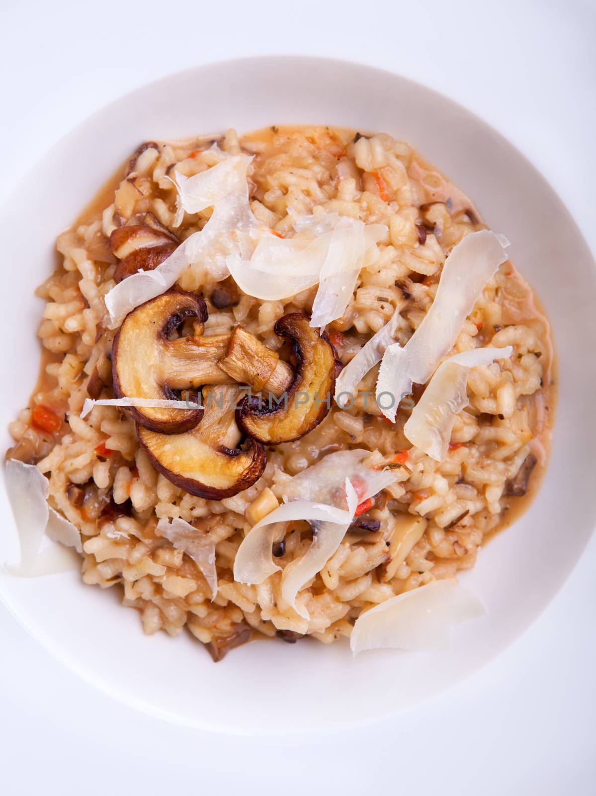 Mushroom risotto Italian cuisine placed on a white background