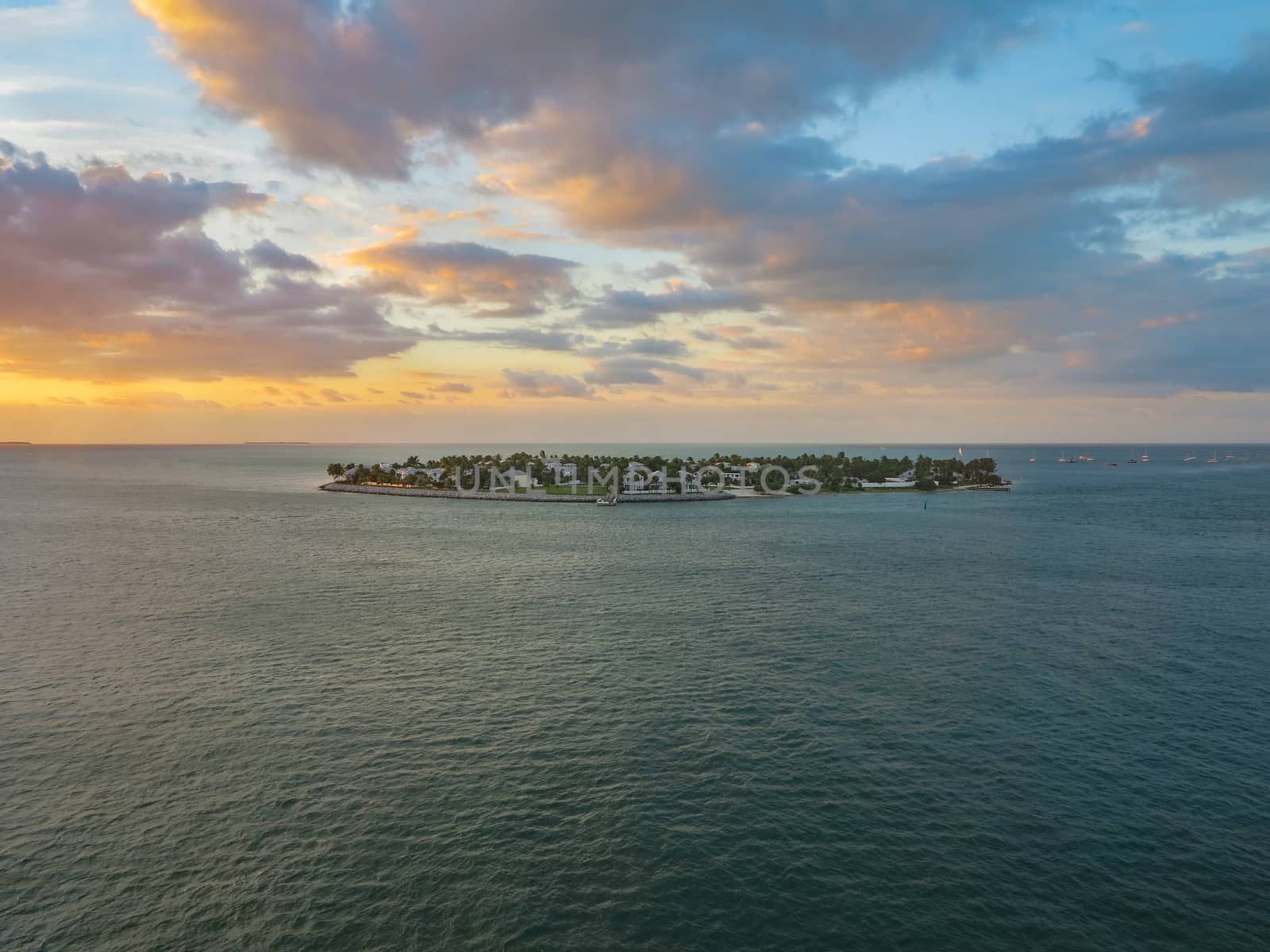 An island of homes in the Atlantic ocean at sunset
