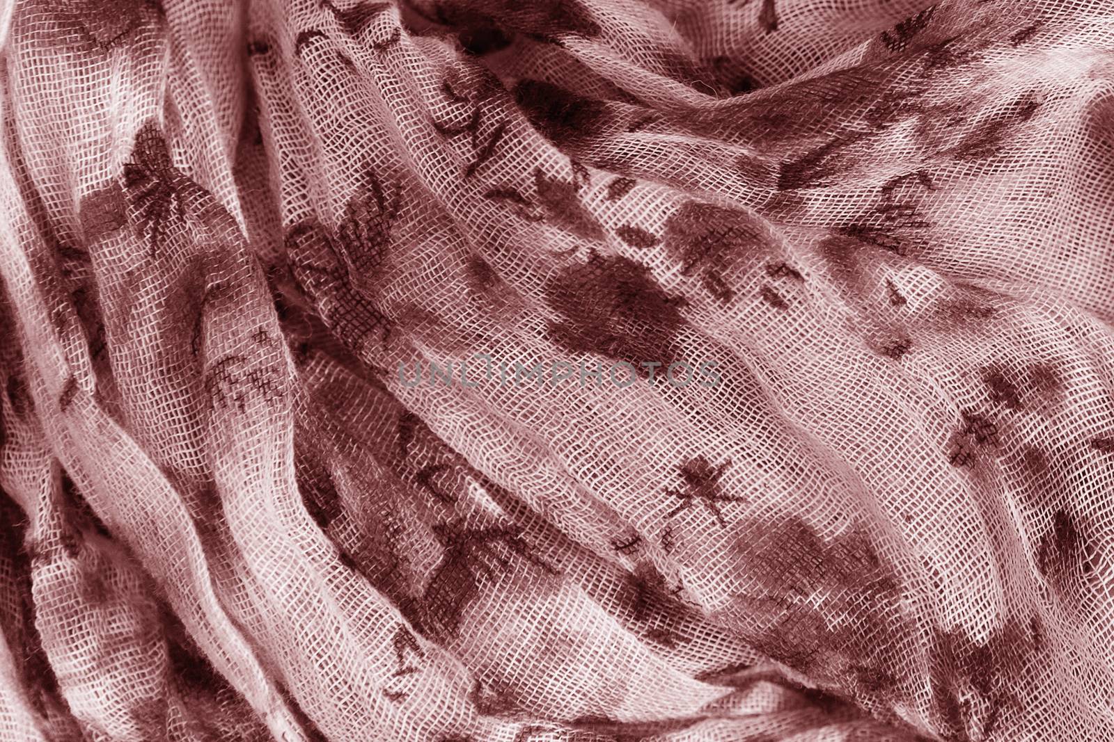 Flower patterned crumpled fabric texture background. Foulard made from modal and cashmere with a positional floral print