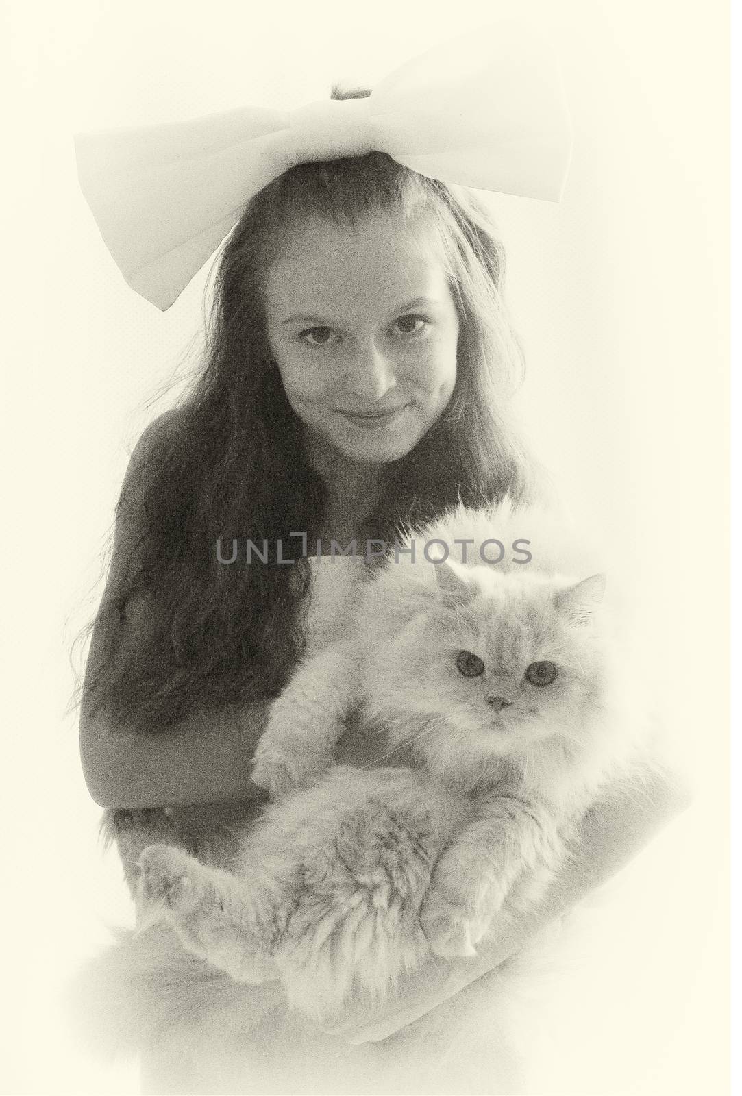 Usual,beautiful portrait of fantastic cute,pretty,nice,perfect,beautiful girl,little girl with long hair and big fluffy Persian cat stand in photo-studio on white background.Black-and-white photo.Cool.Little,smiling,cheerful,happy girl embrace a cat.
