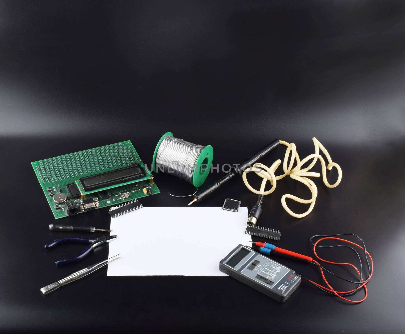 Mock up objects such as industrial controllers on a black background with copy space, front view