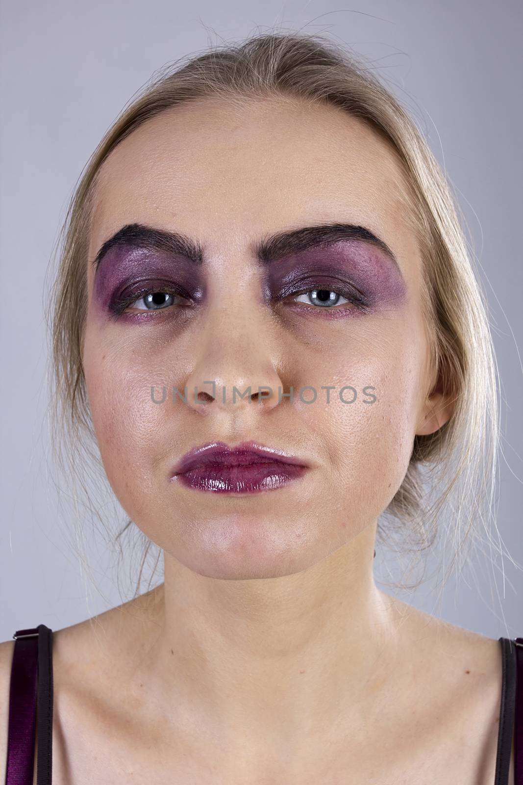 Portrait of a young woman with pride on a gray background. Seven Deadly Sins