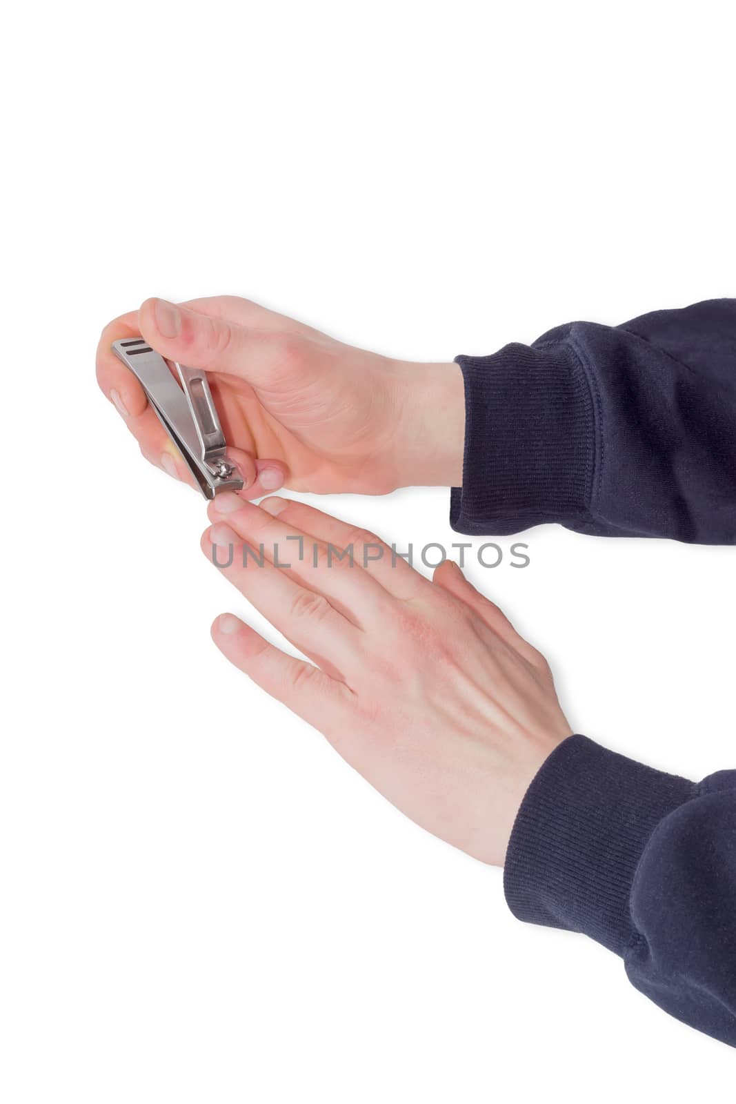 Nail clipper in the compound lever style made of stainless steel in male hands during trimfinger nails on a light background
