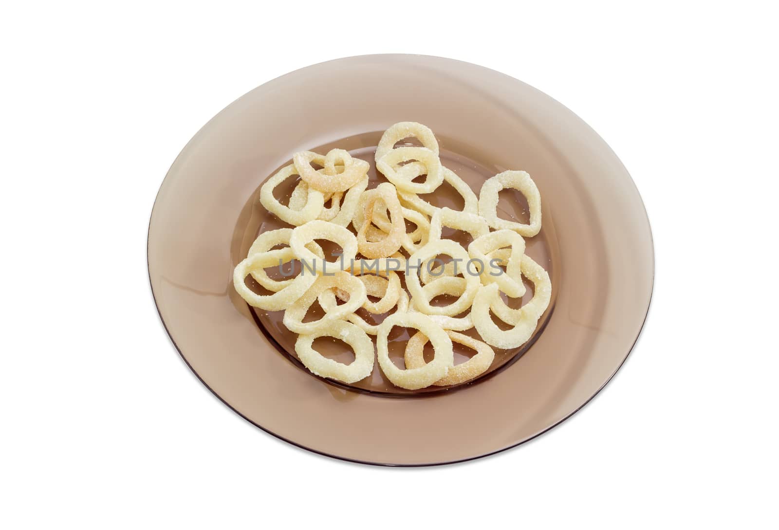 Potato chips with appearance of a fried squid rings and taste of a calamari on dark glass dish on a light background
