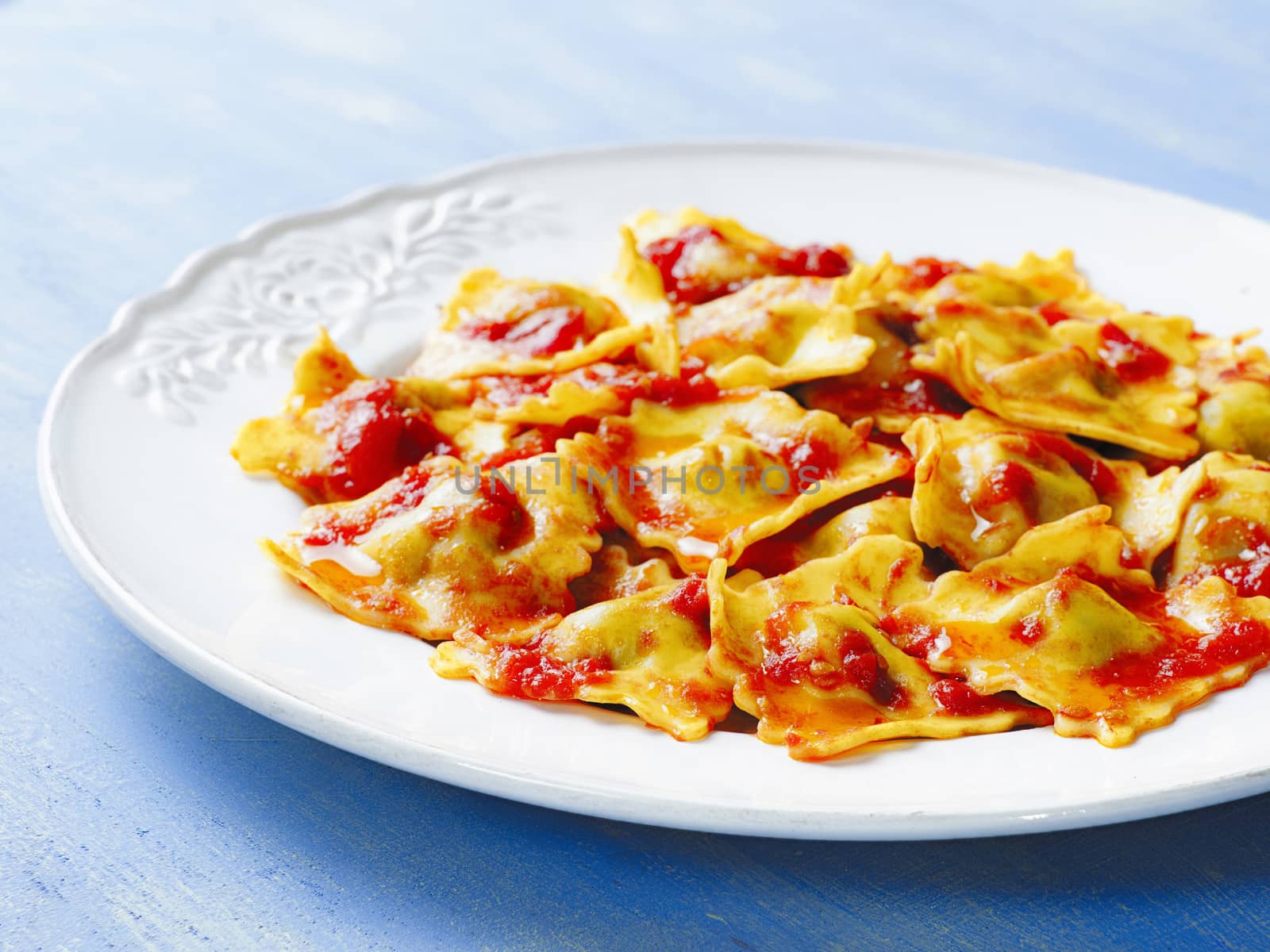 italian ravioli pasta in tomato sauce by zkruger