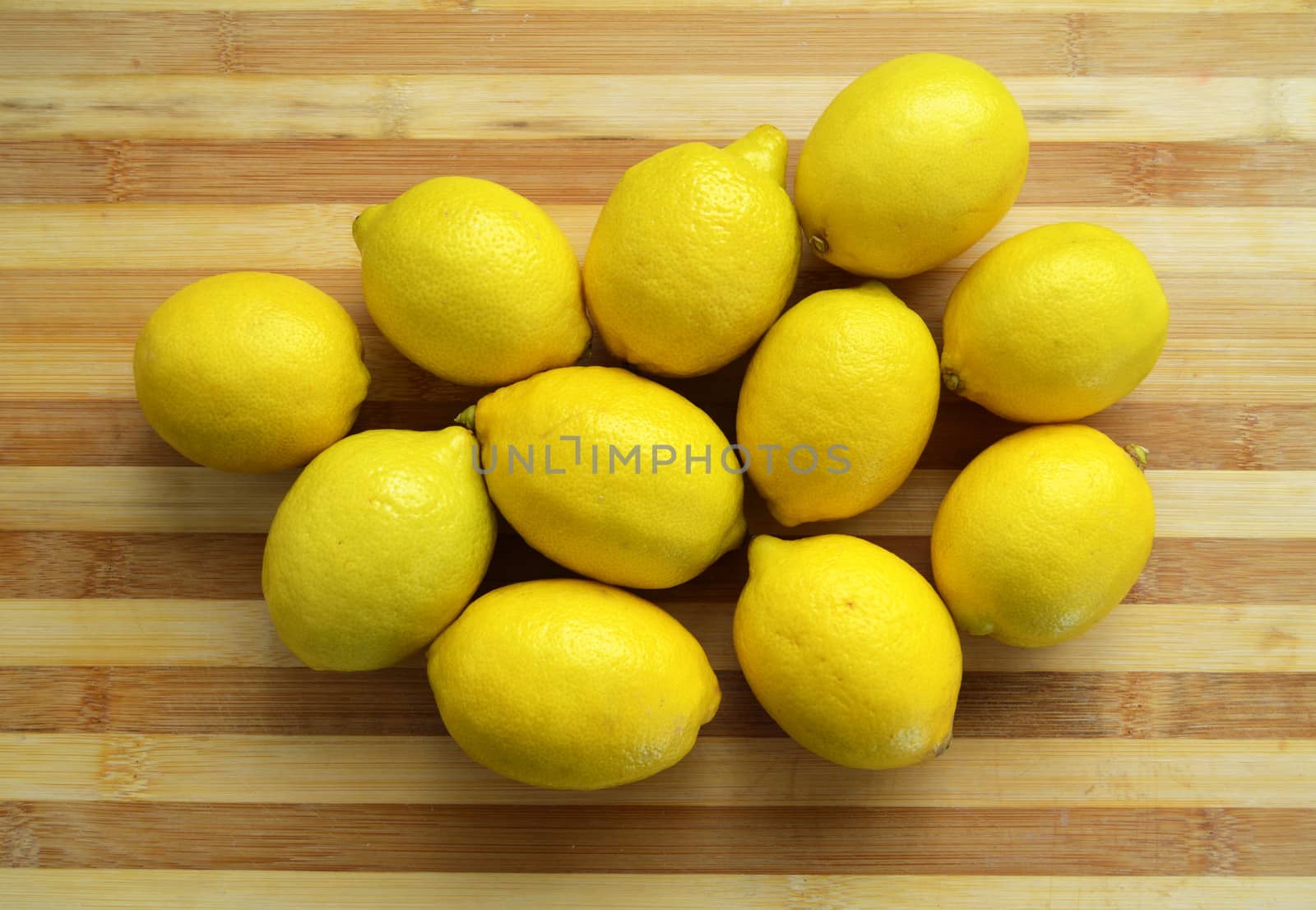 Lemon paintings on the finest wooden chopping board by nhatipoglu