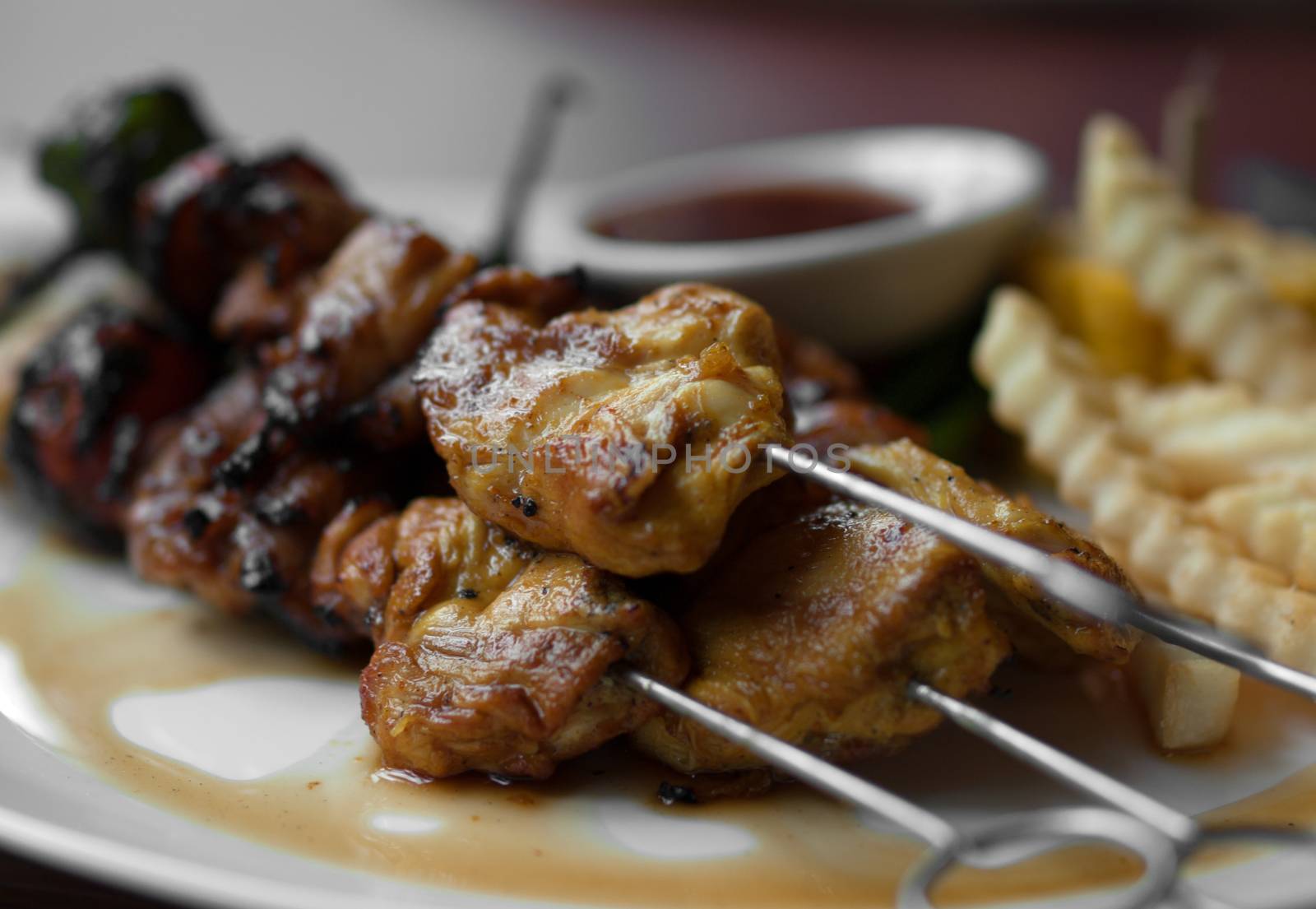 PLATE OF GRILLED MARINATED CHICKEN SATAY