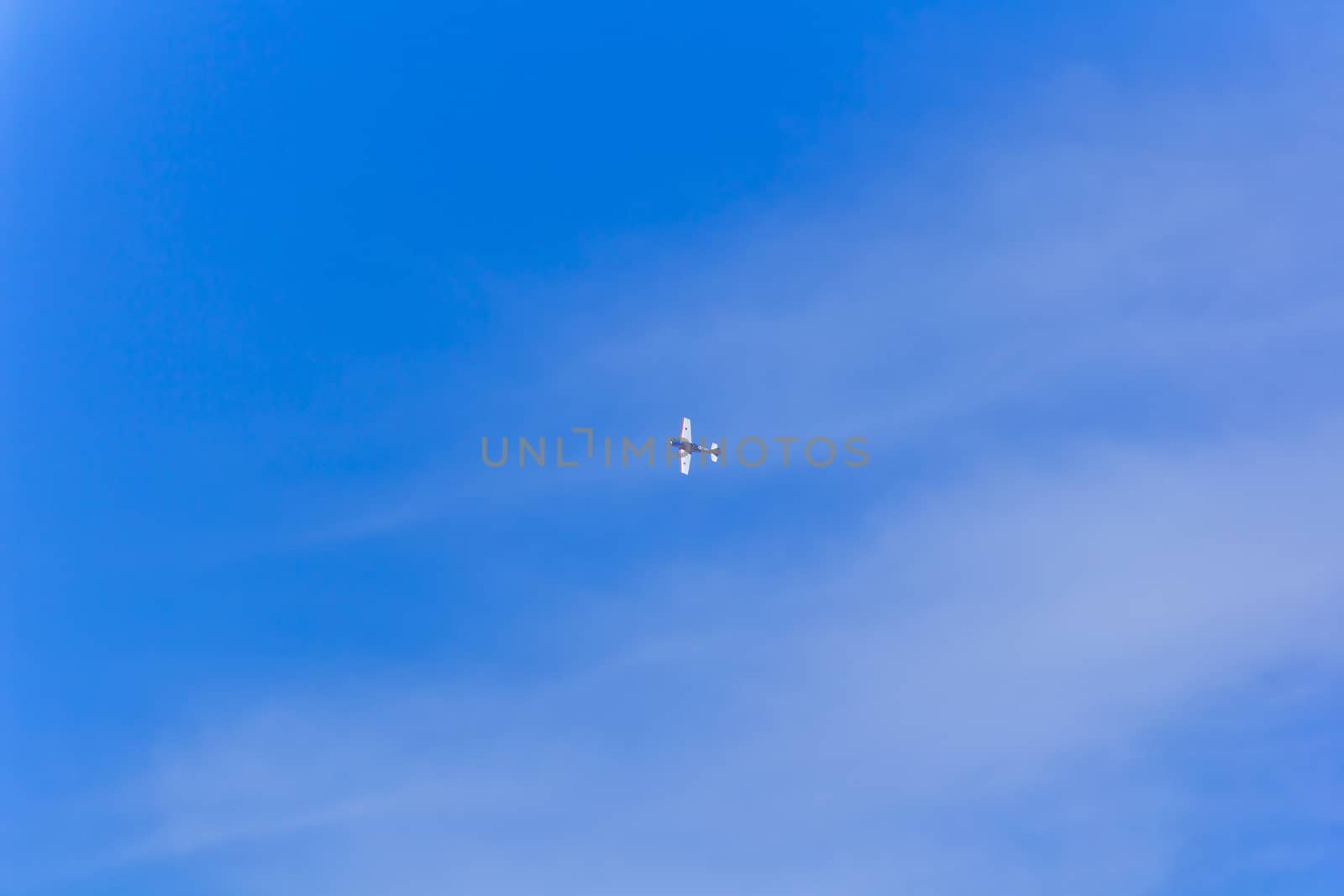 Photo of flying military plane in blue sky