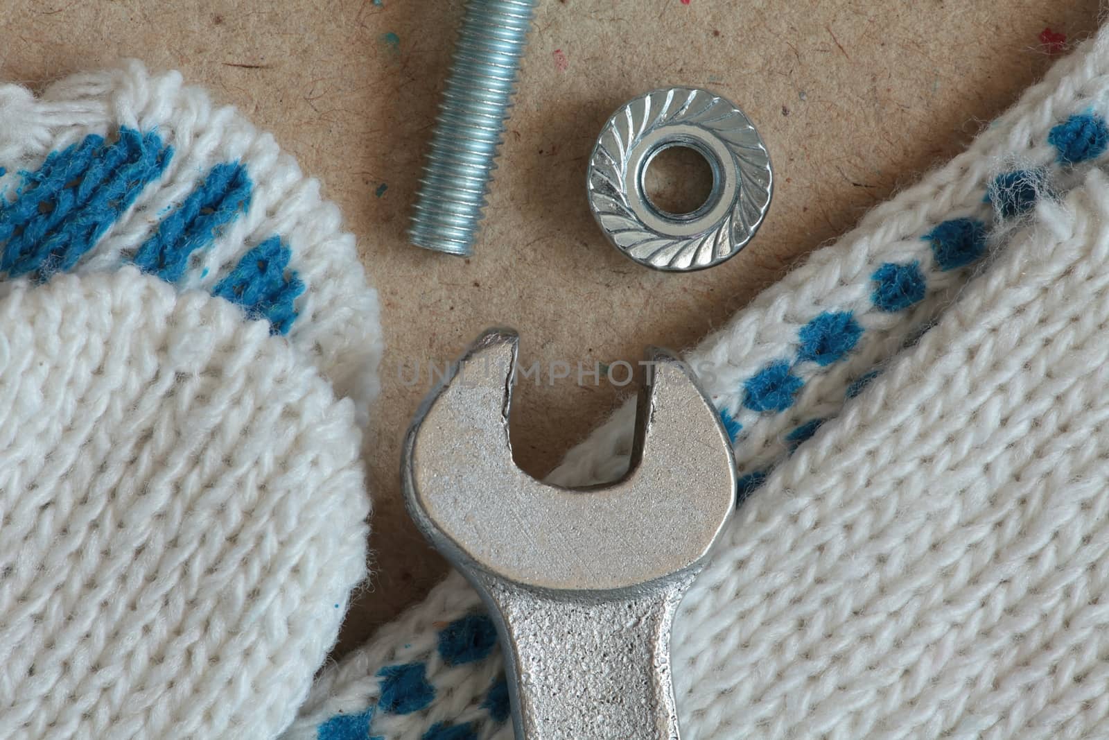 Workplace mechanic wrench gloves bolt and nut macro shot