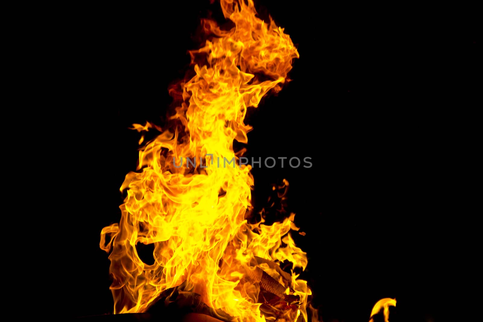 Photo of red fire flame on black background