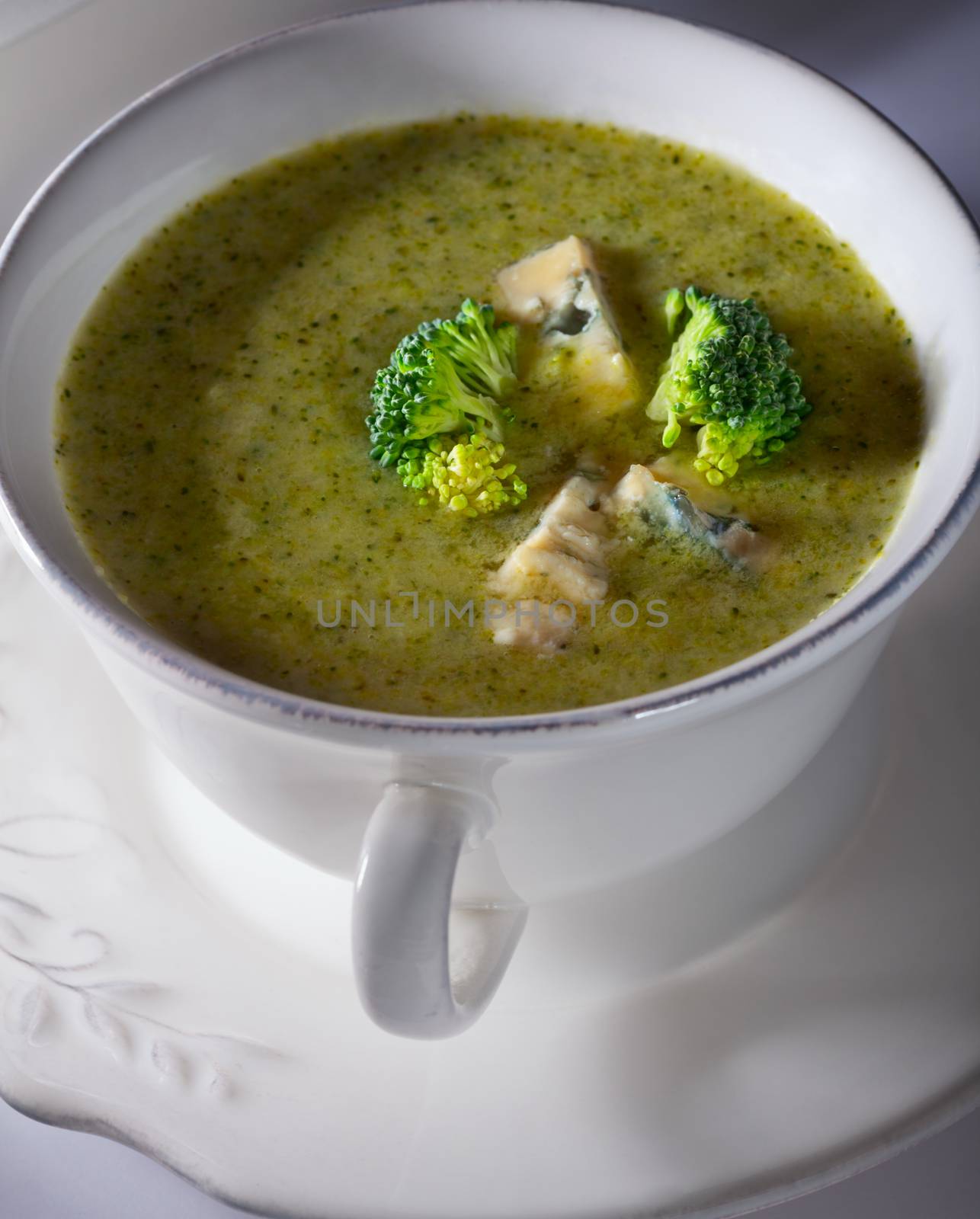 A bowl of creamy broccoli soup with blue cheese. by supercat67