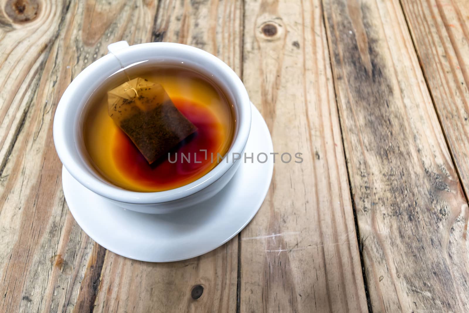 Cup of Hot Tea on Wood Table by jpldesigns