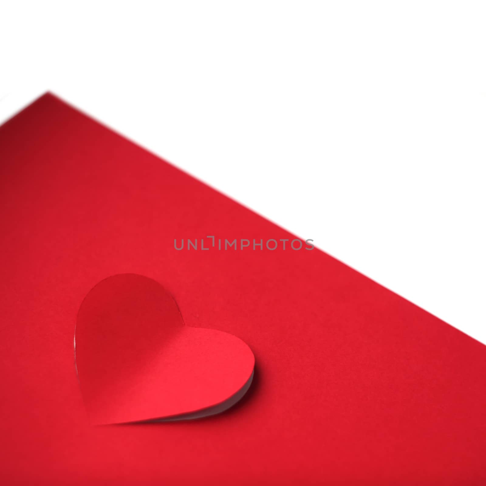 Heart cut in paper background by destillat