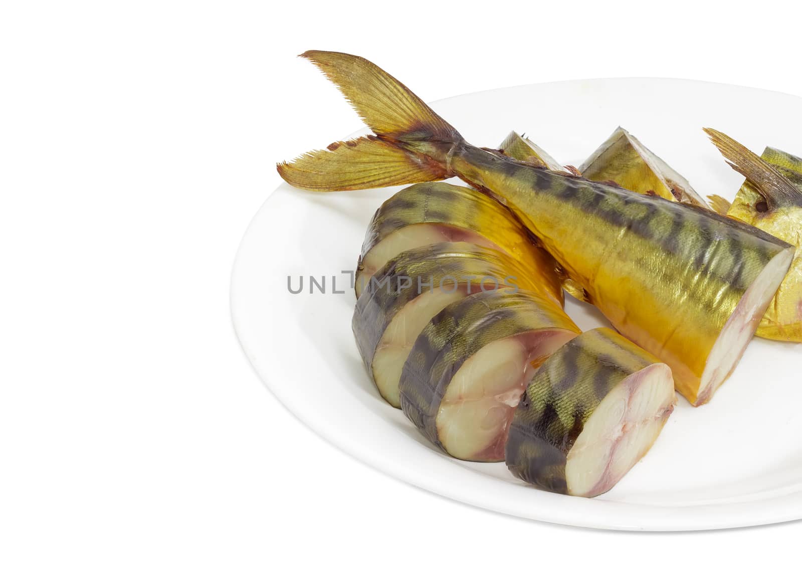 Fragment of a white dish with several slices of a cold-smoked Atlantic mackerel on a light background
