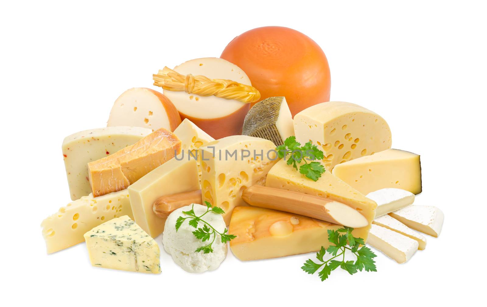 Different pieces of hard cheese, semi-soft cheese and soft cheese various types and twigs of parsley on a light background
