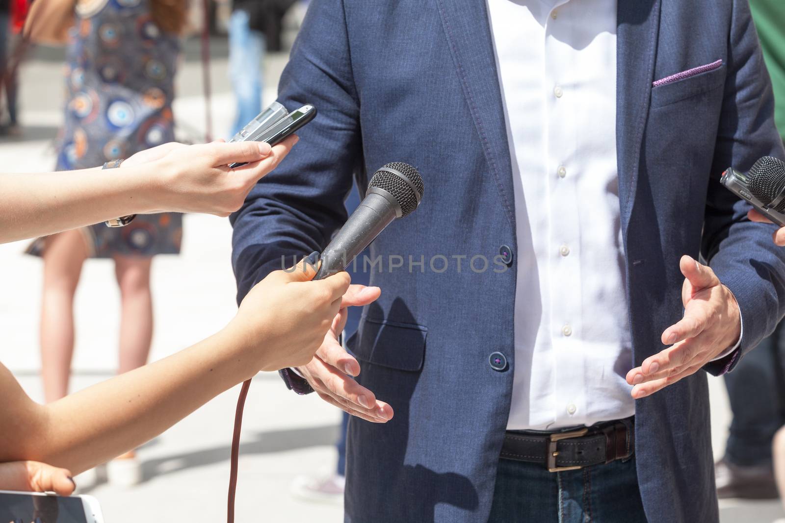 Reporters making interview with businessman or politician