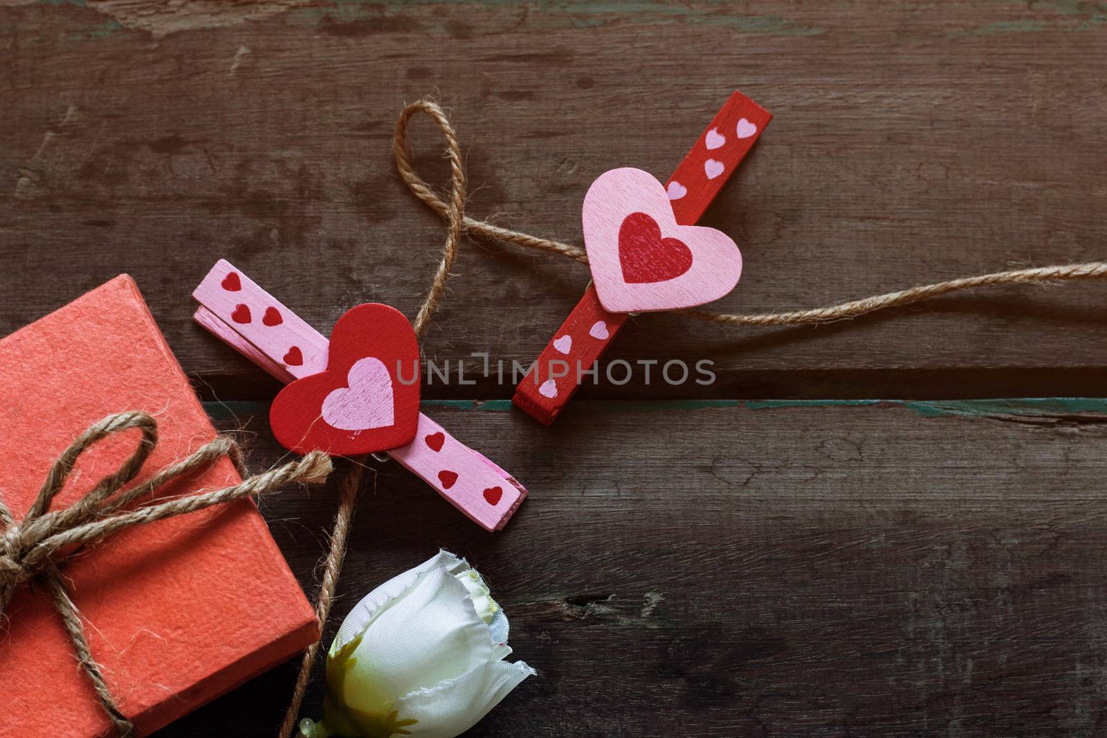 heart and gift on a wooden. by start08