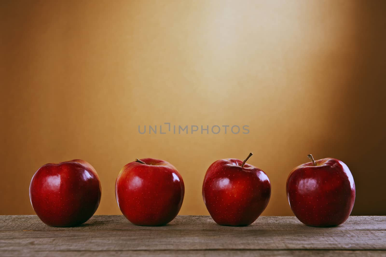 Red apples on a wooden table by Michalowski