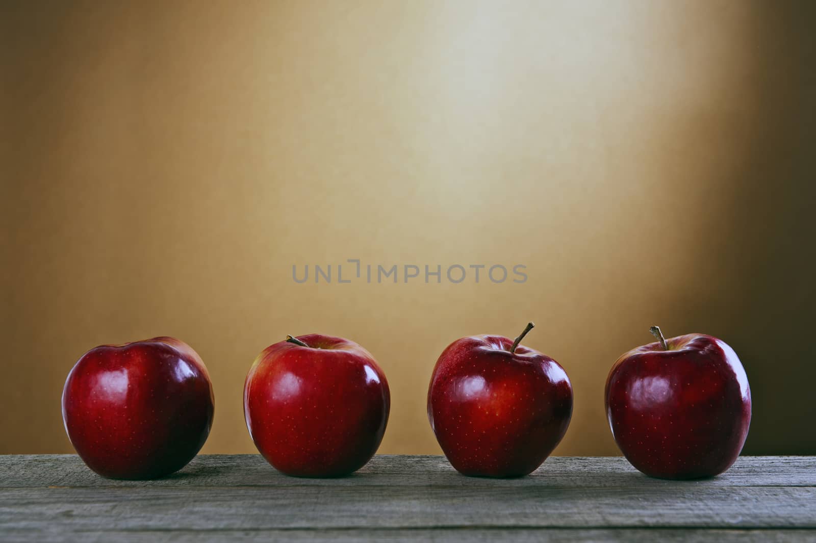 Red apples on a wooden table by Michalowski
