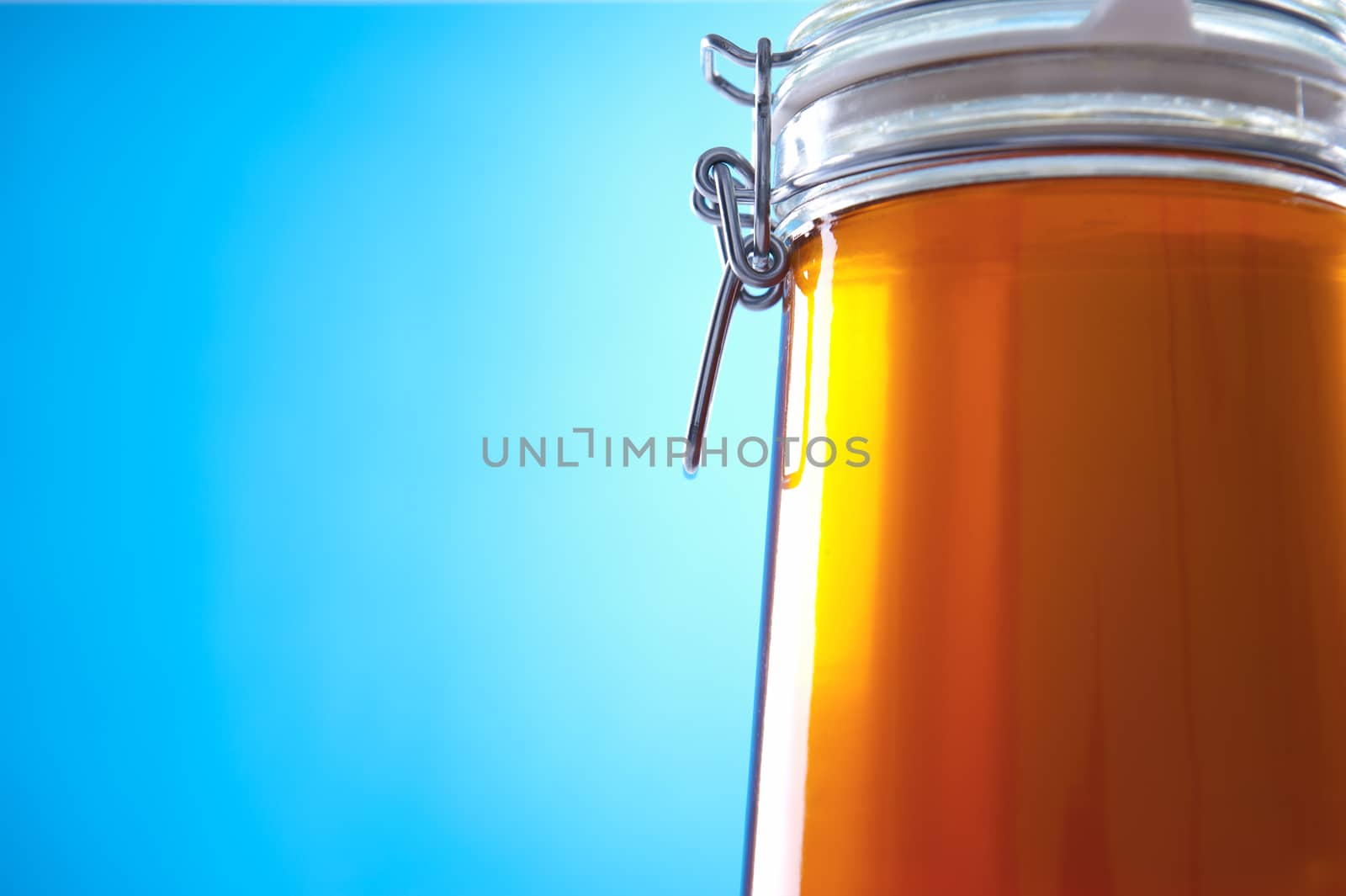 Polish jar of honey flower on a blue background
