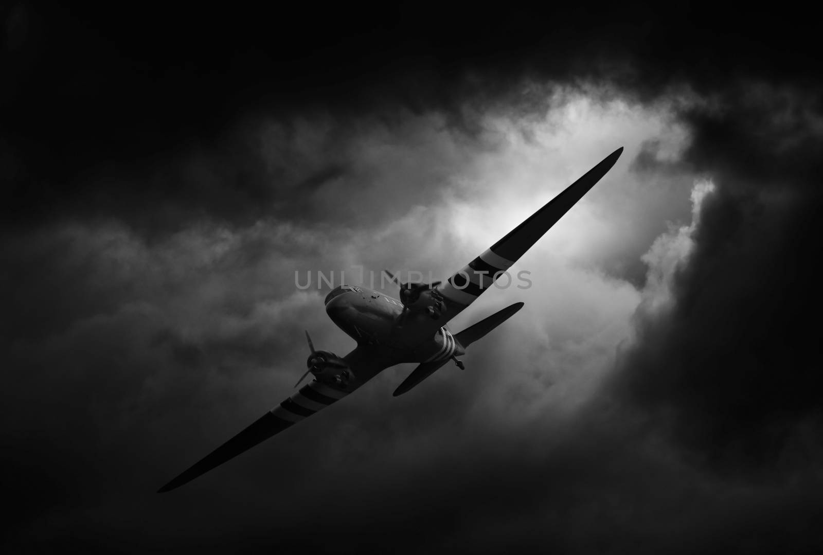 dakota airplane in stormy weather by itsajoop