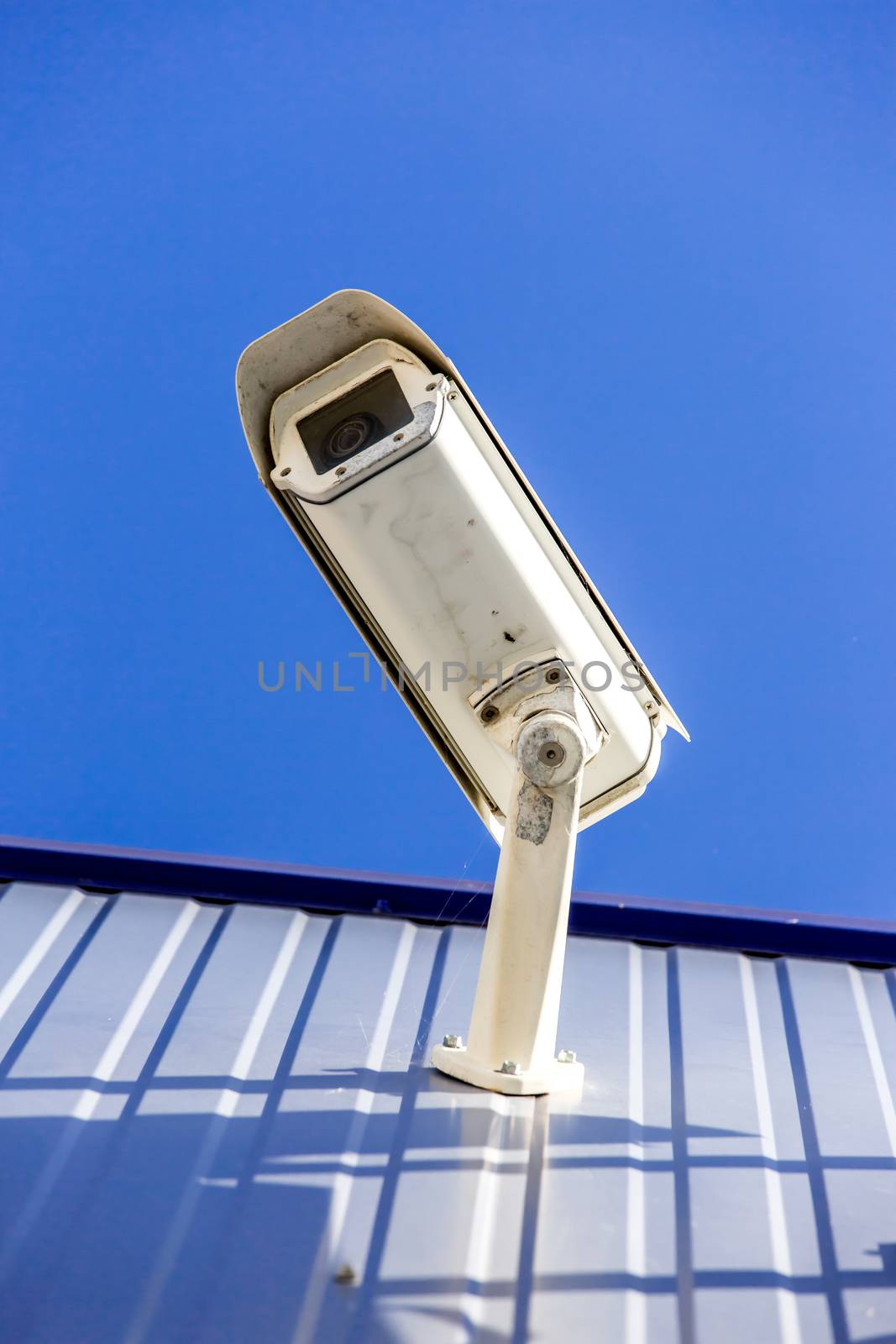 closeup on security CCTV camera or surveillance system in office building