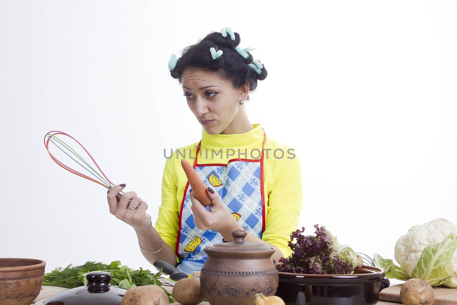 Housewife is preparing in the kitchen on a white background