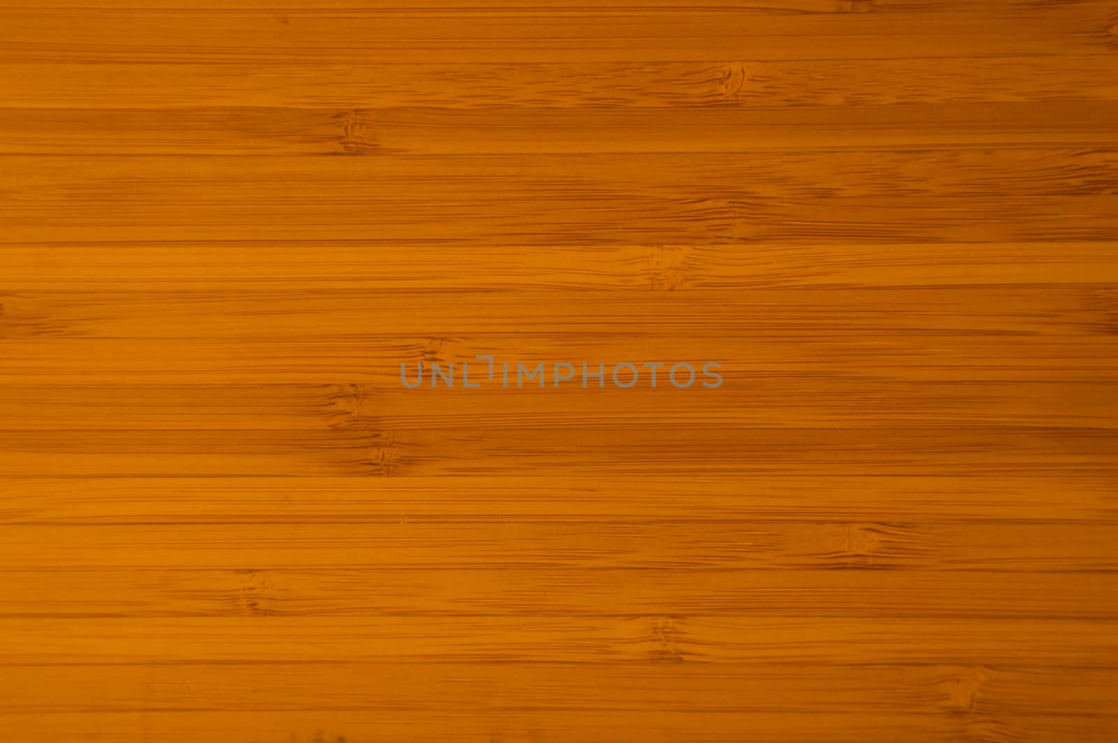 Deep orangy gold wooden board filling the image with horizontal bamboo strips