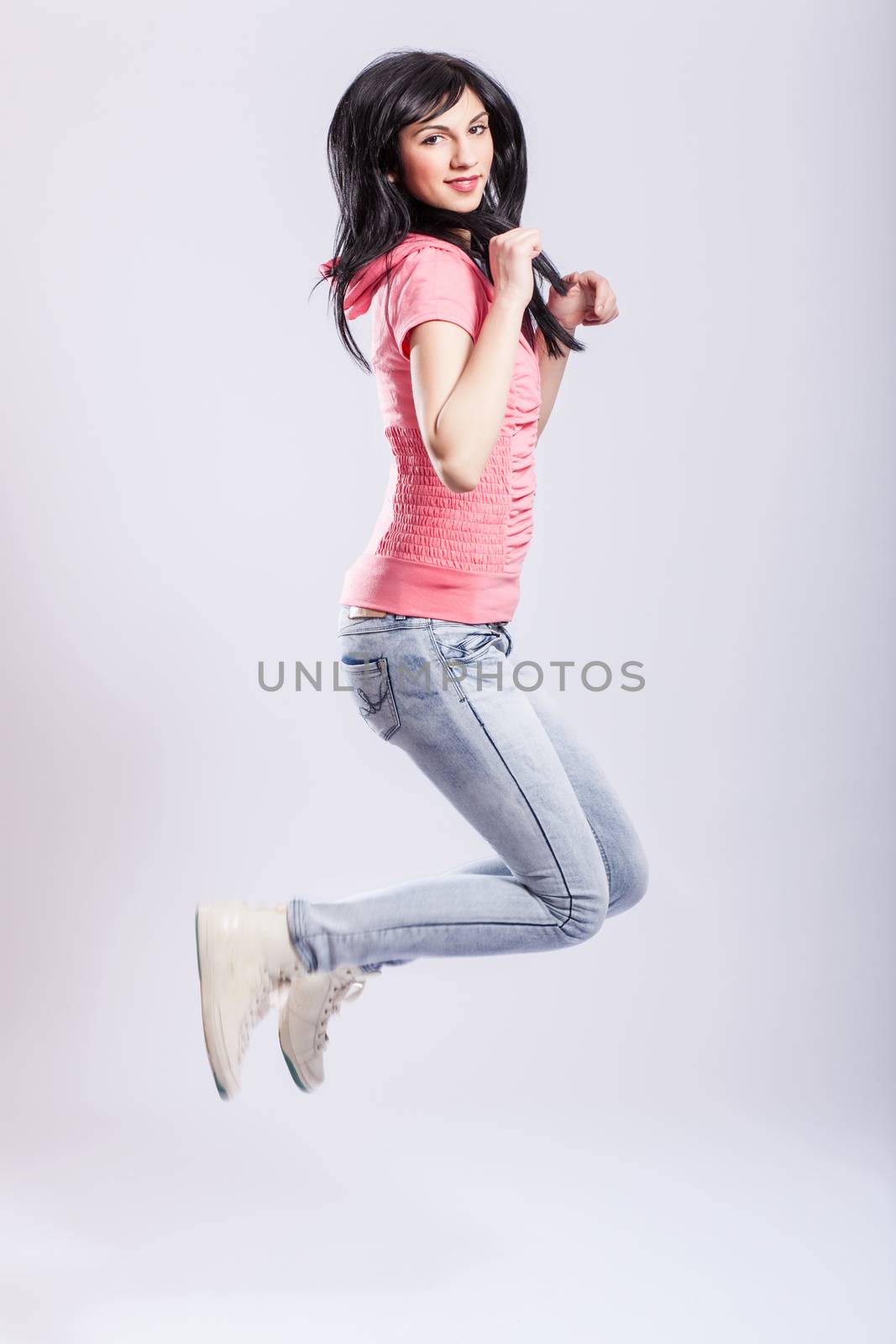 attractive young girl jumping by kokimk